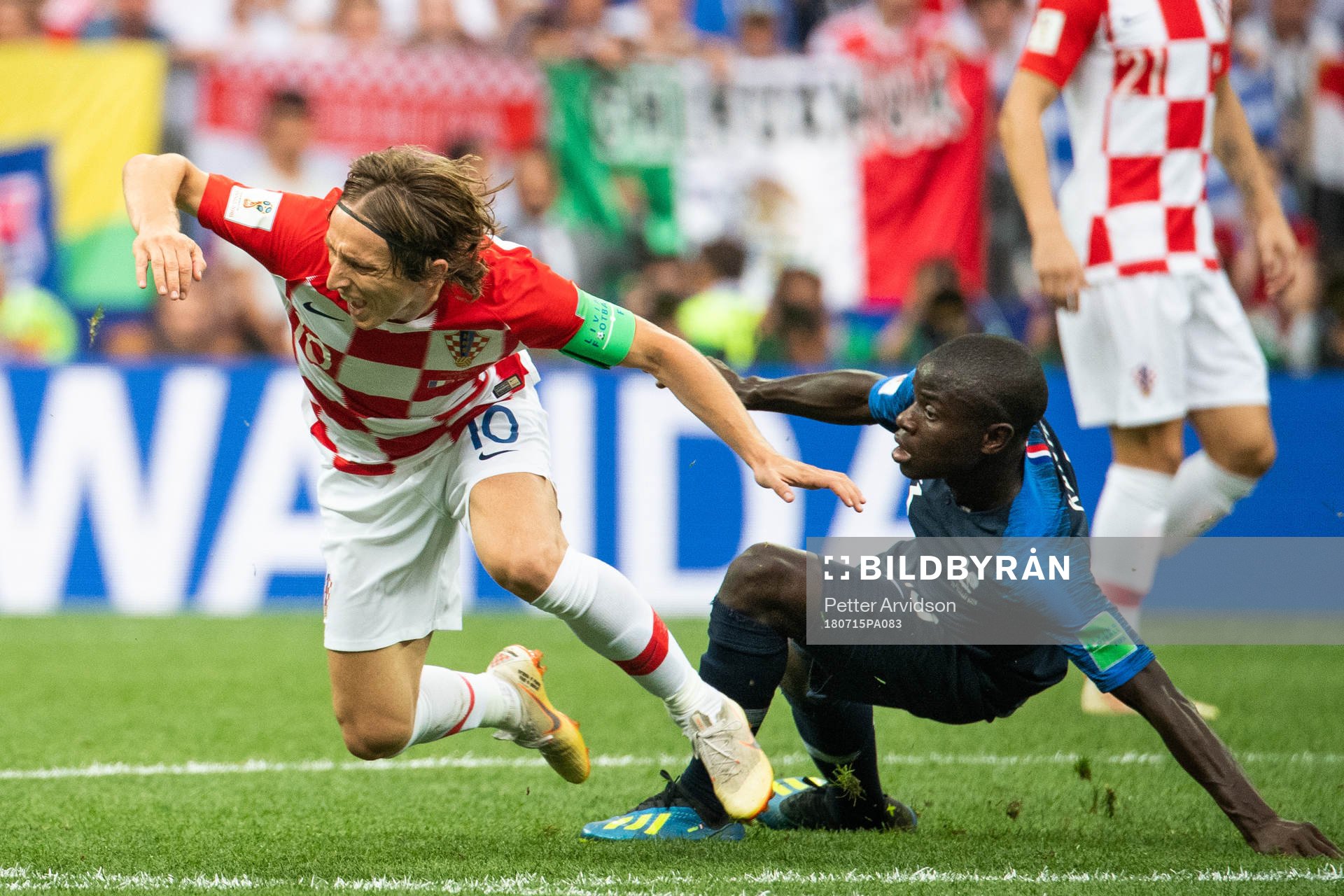 Luka Modric of Croatia falls in a duel with Ngolo Kante of