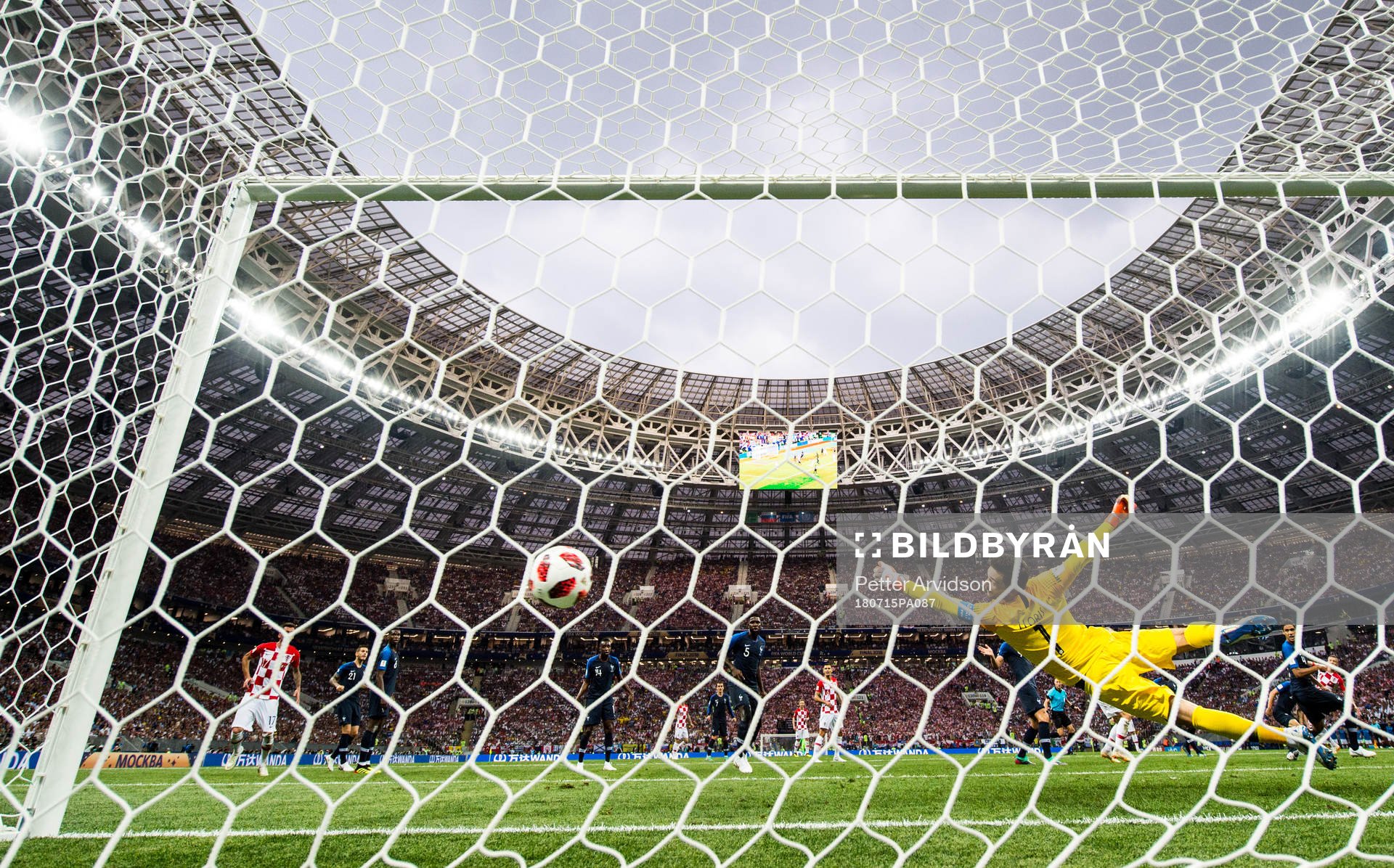 Ivan Perisic of Croatia scores the 1-1 goal behind