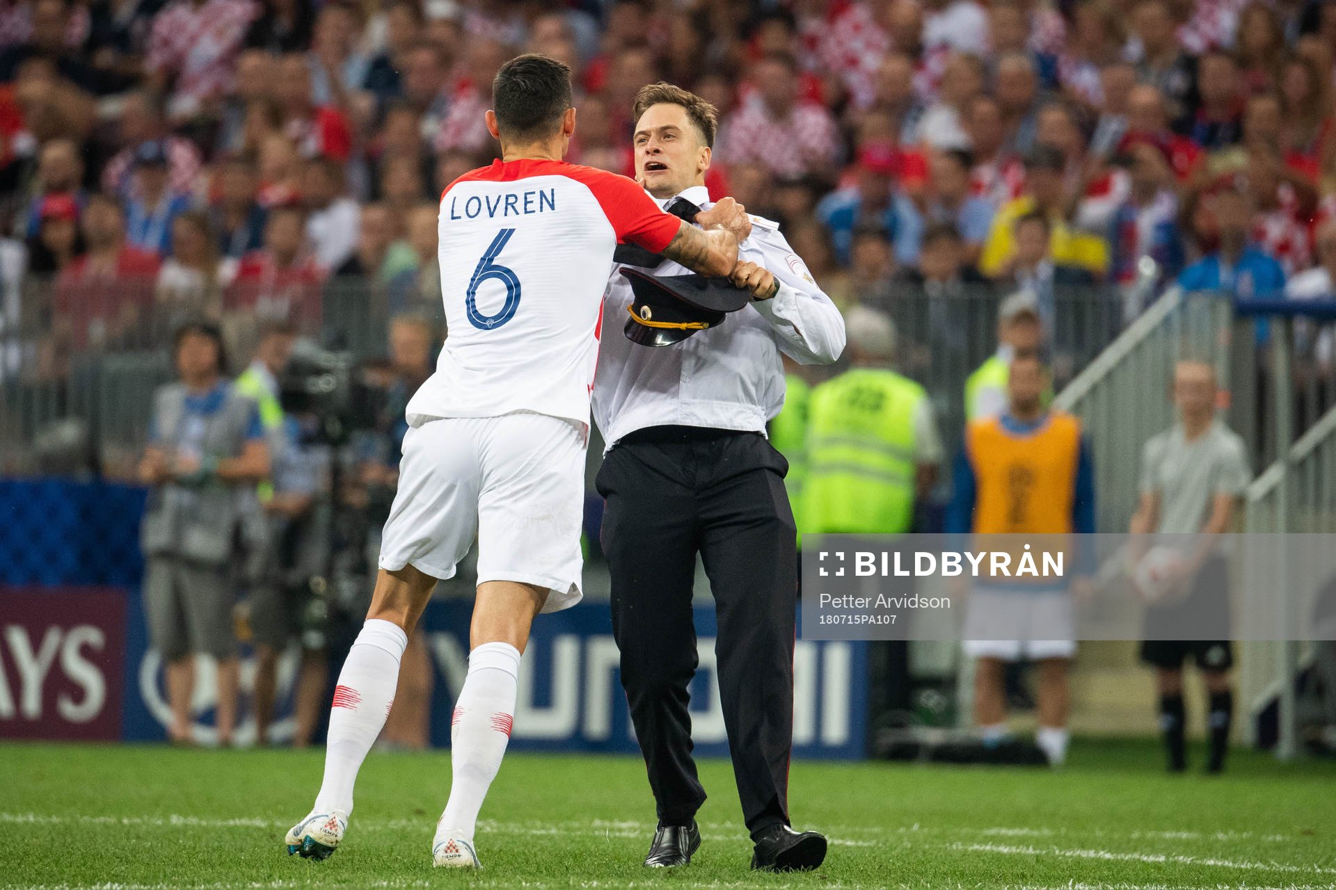Dejan Lovren of Croatia in a situation with a man who has