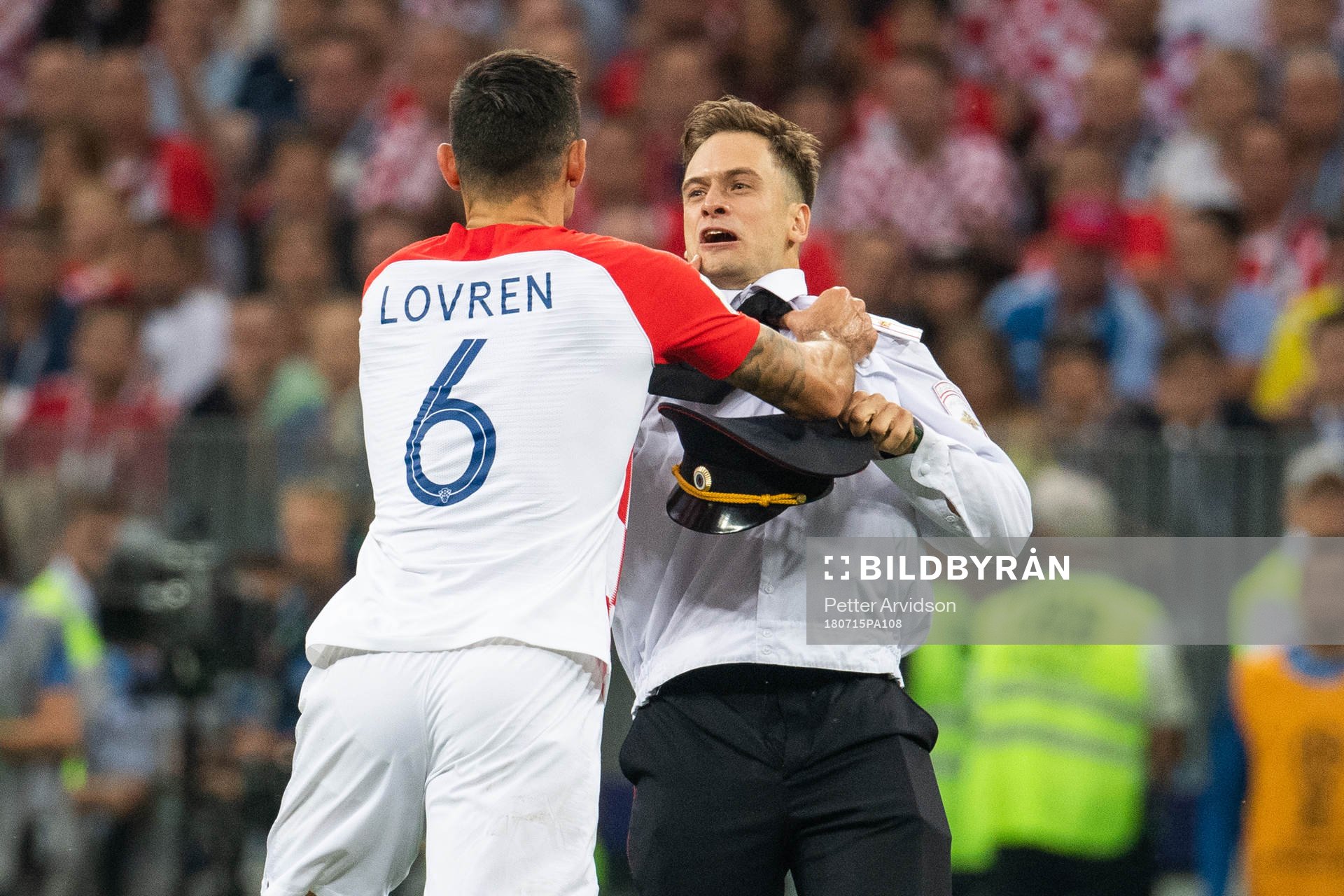 Dejan Lovren of Croatia in a situation with a man who has