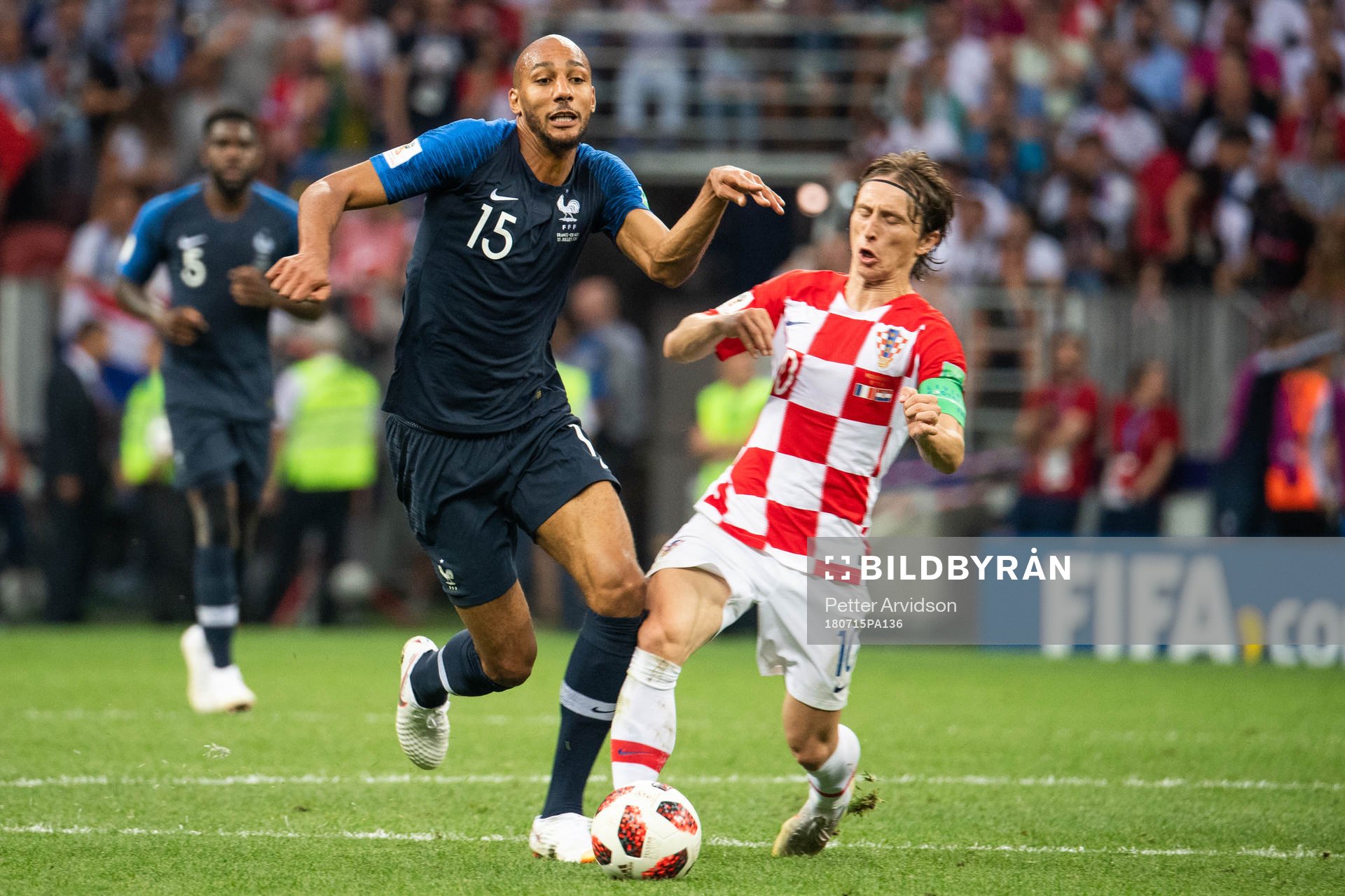 Steven Nzonzi of France falls in a duel with Luka Modric of