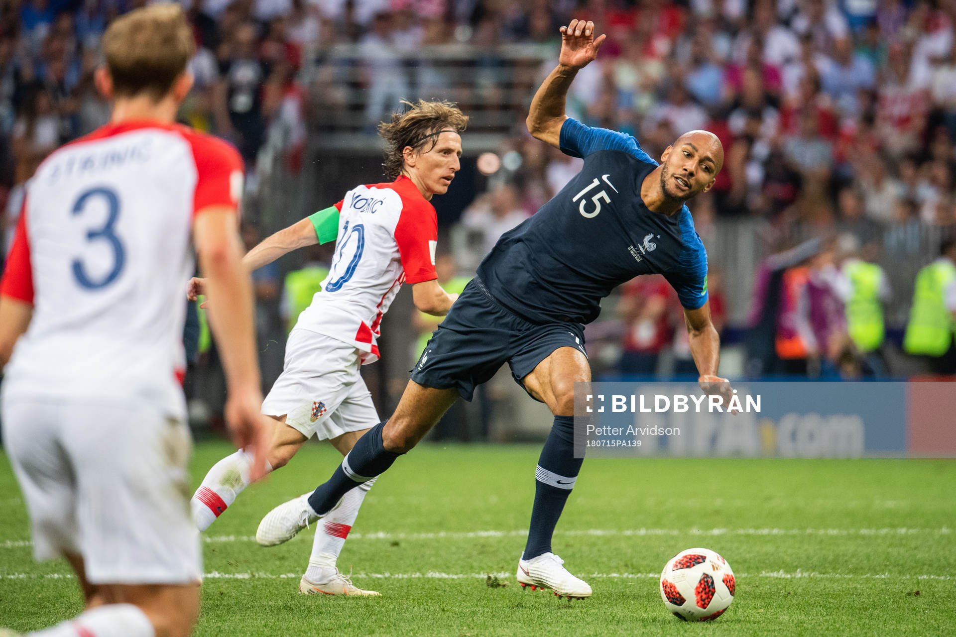 Steven Nzonzi of France falls in a duel with Luka Modric of