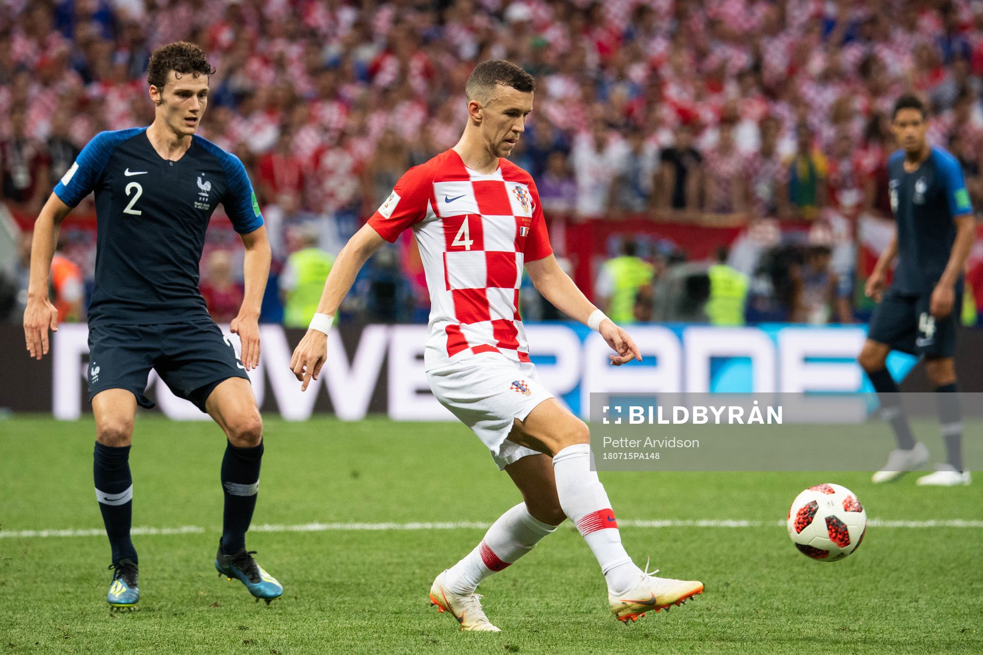 Benjamin Pavard of France and Ivan Perisic of Croatia