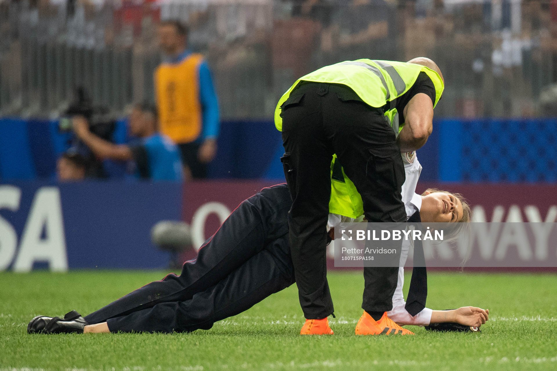 A Steward holds apitch invader