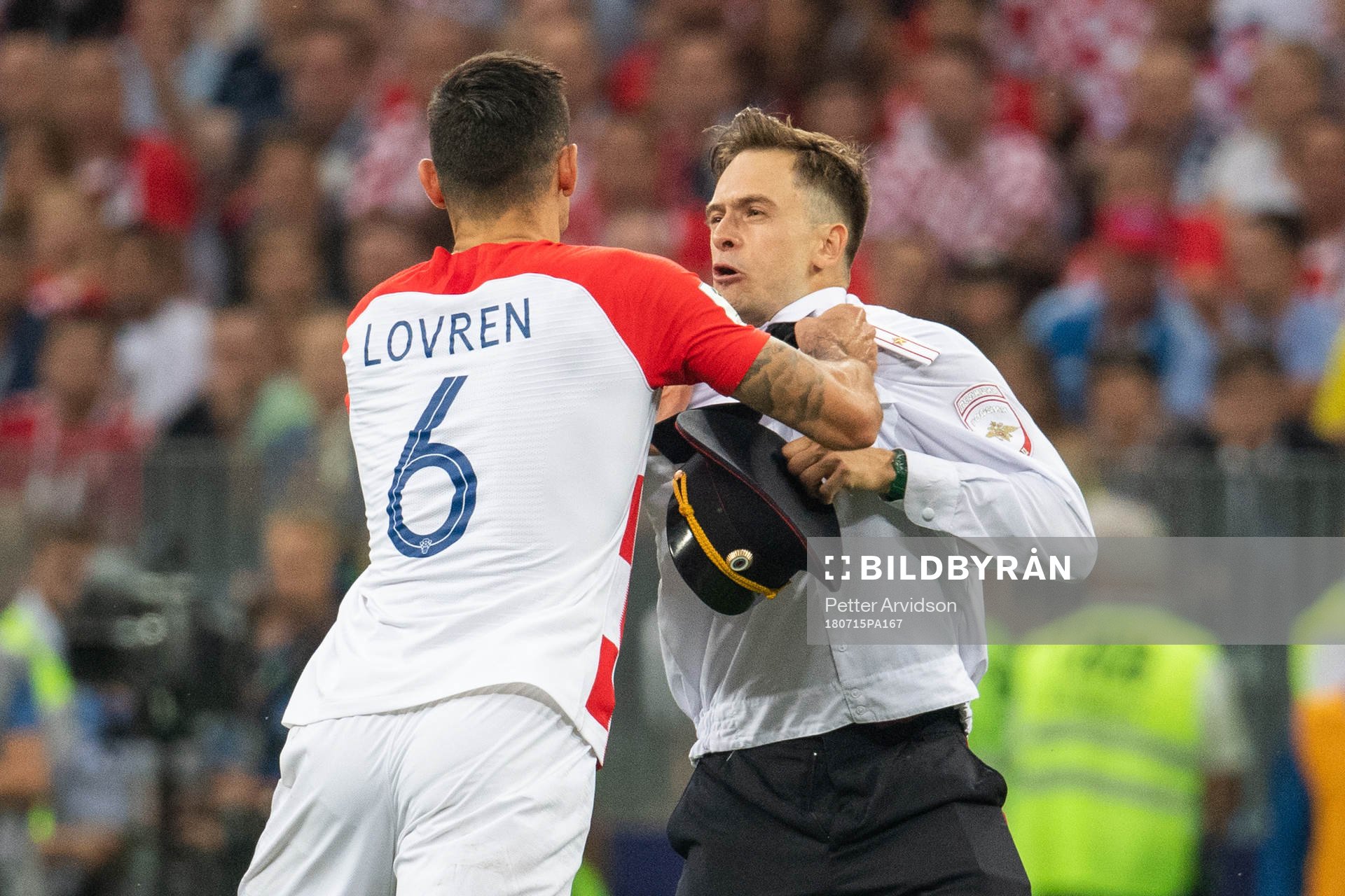 Dejan Lovren of Croatia in a situation with a man who has