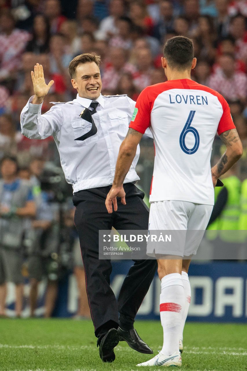 Dejan Lovren of Croatia in a situation with a man who has