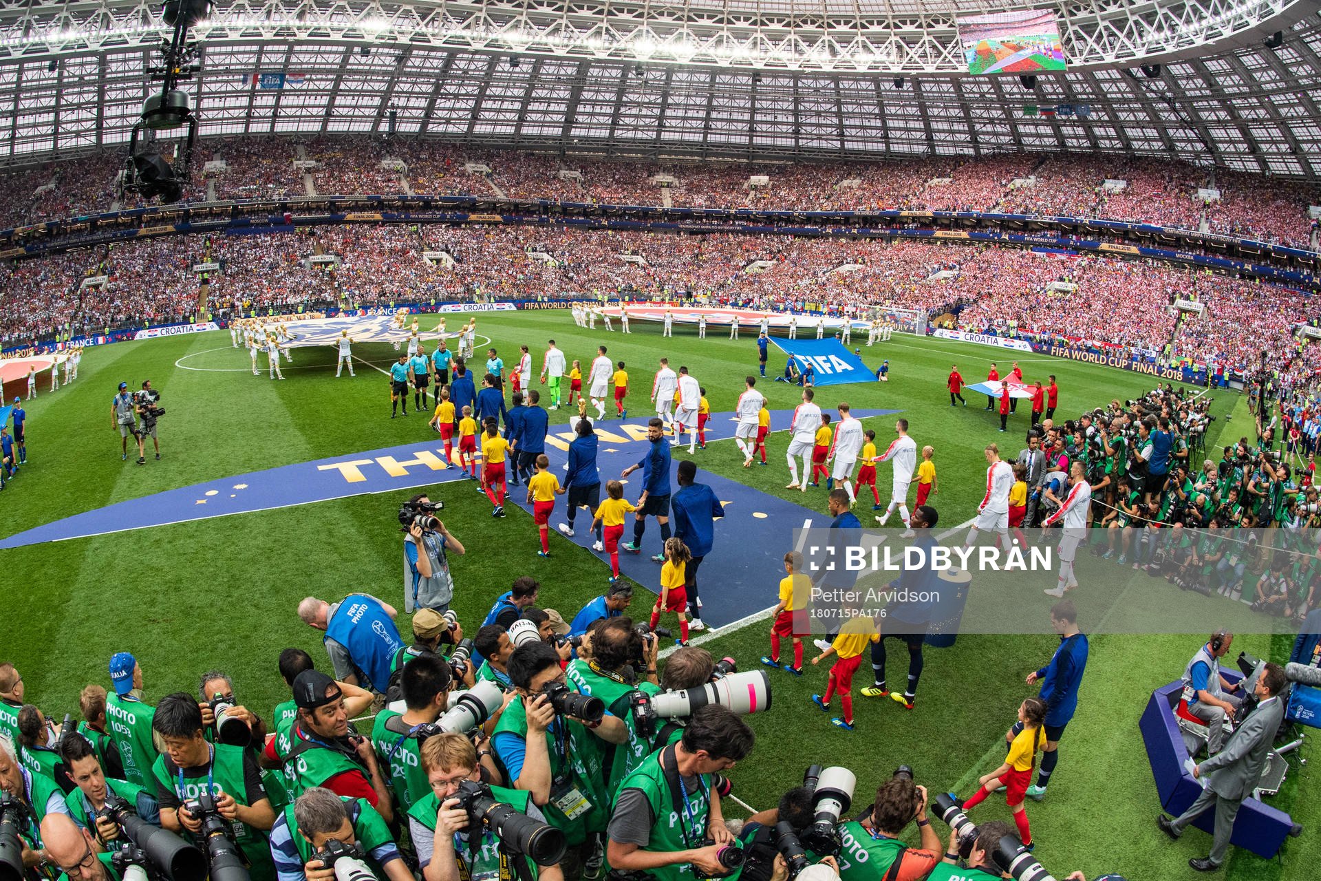 Players of France and of Croatia enter the pitch prior to