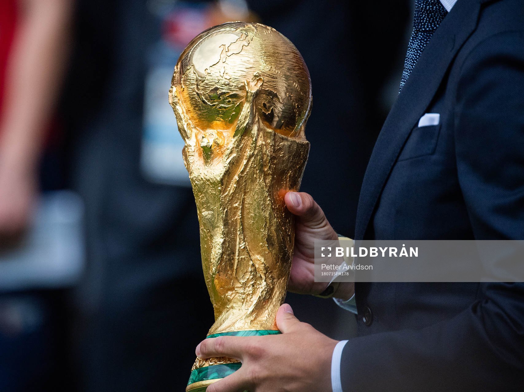 Philipp Lahm brings the World Cup Trophy in to the stadium