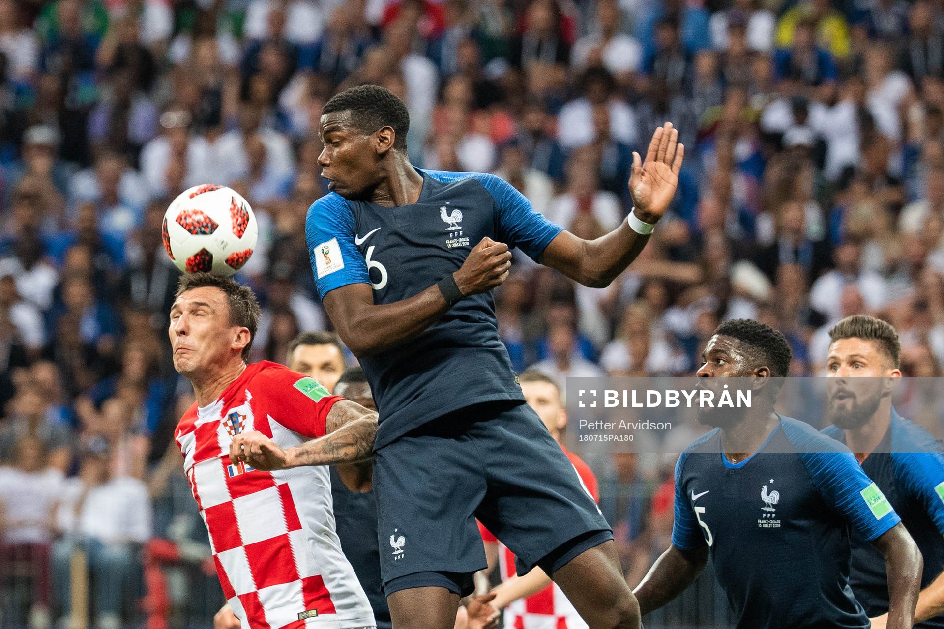 Mario Mandzukic of Croatia and Paul Pogba of France