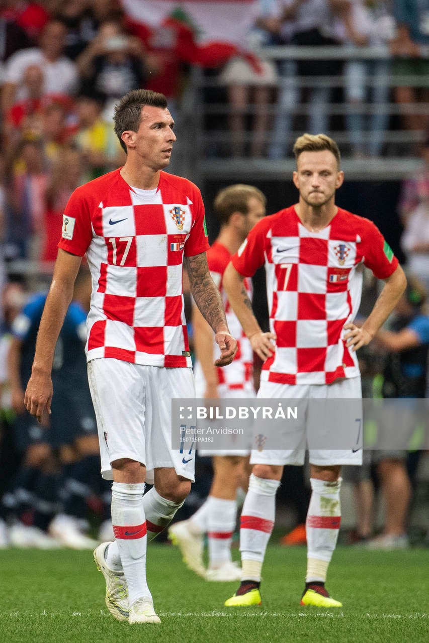 Mario Mandzukic and Ivan Rakitic of Croatia looks dejected