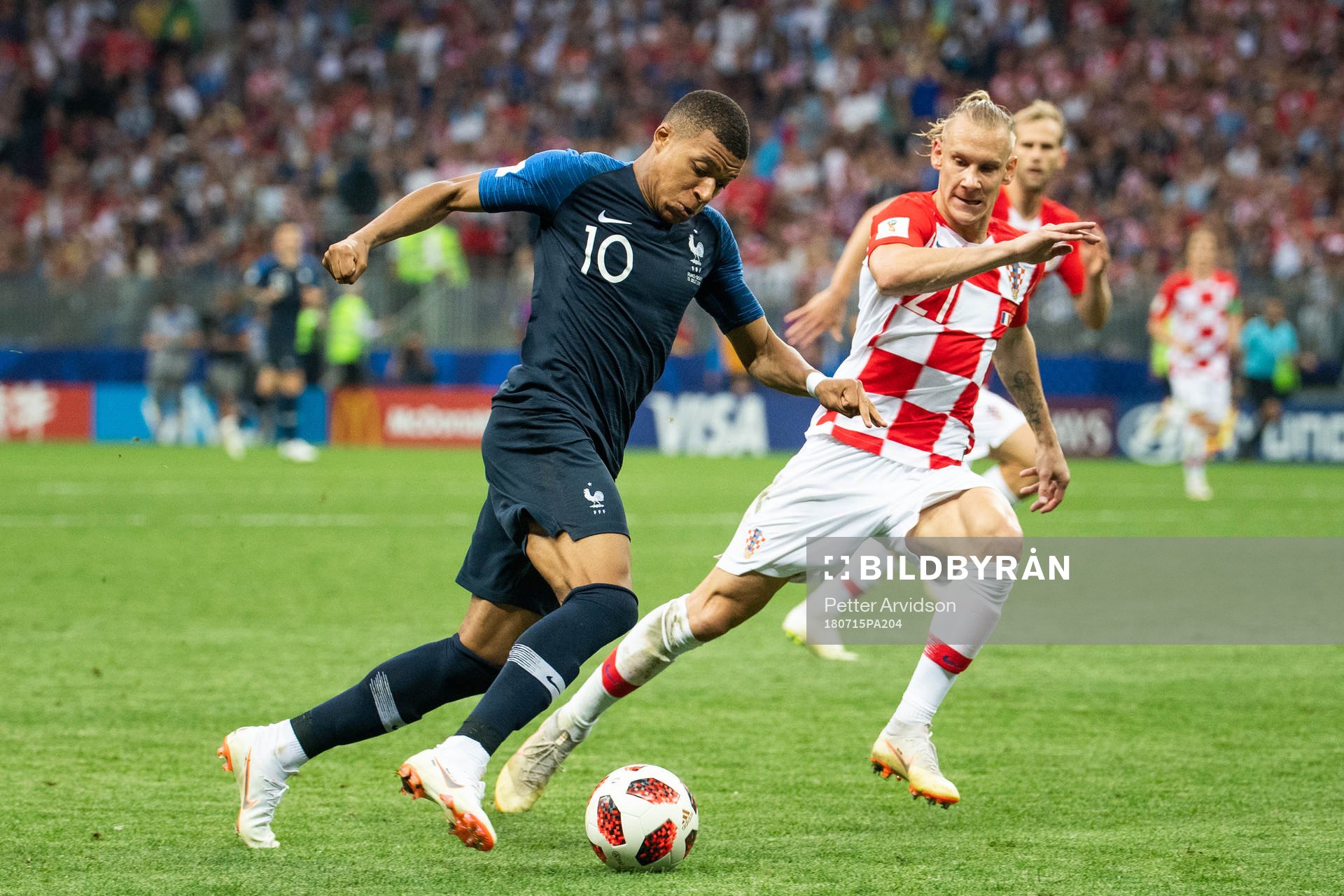 Kylian Mbappe of France and Domagoj Vida of Croatia