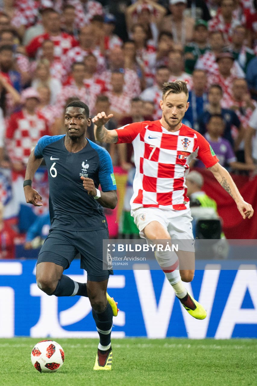 Paul Pogba of France and Ivan Rakitic of Croatia competes
