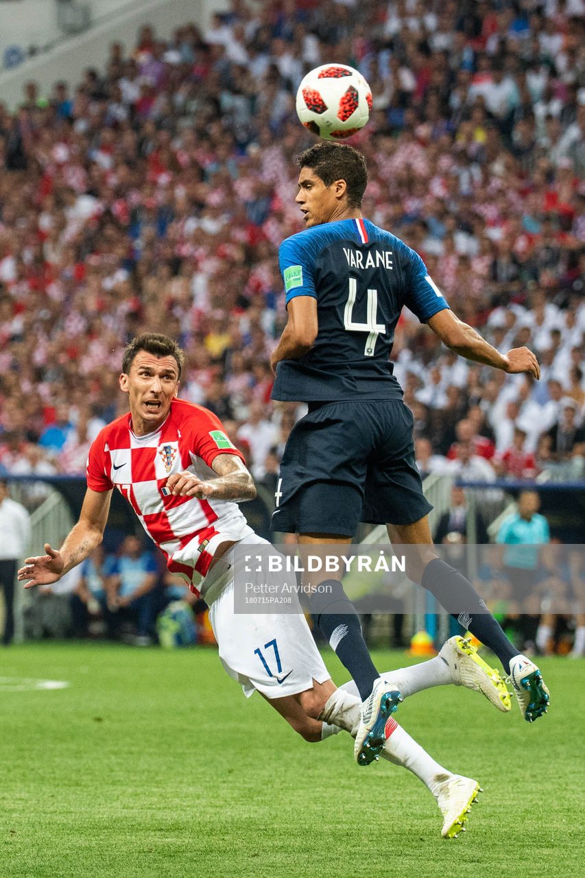 Mario Mandzukic of Croatia and Raphael Varane of France
