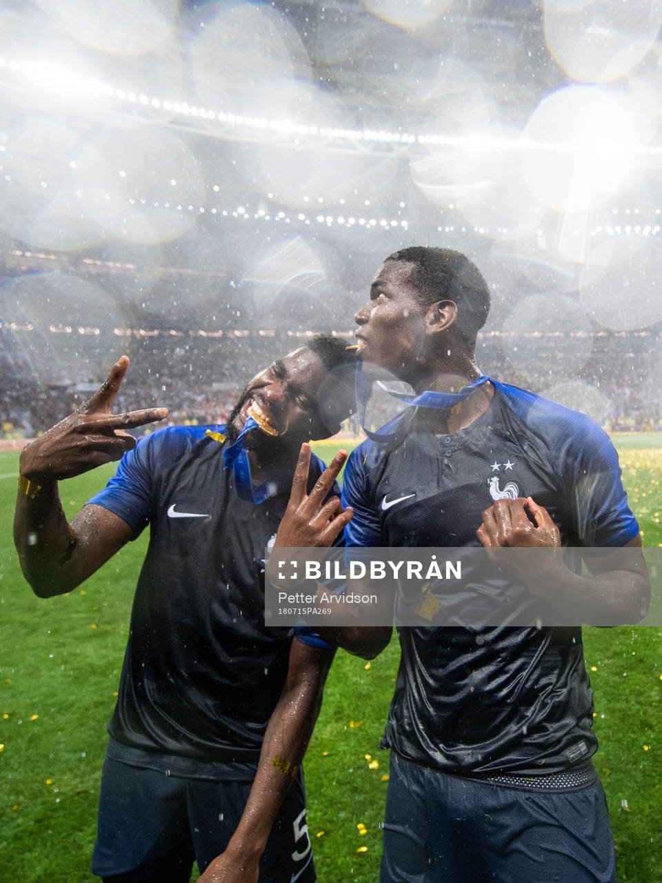 Samuel Umtiti and Paul Pogba of France celebrate
