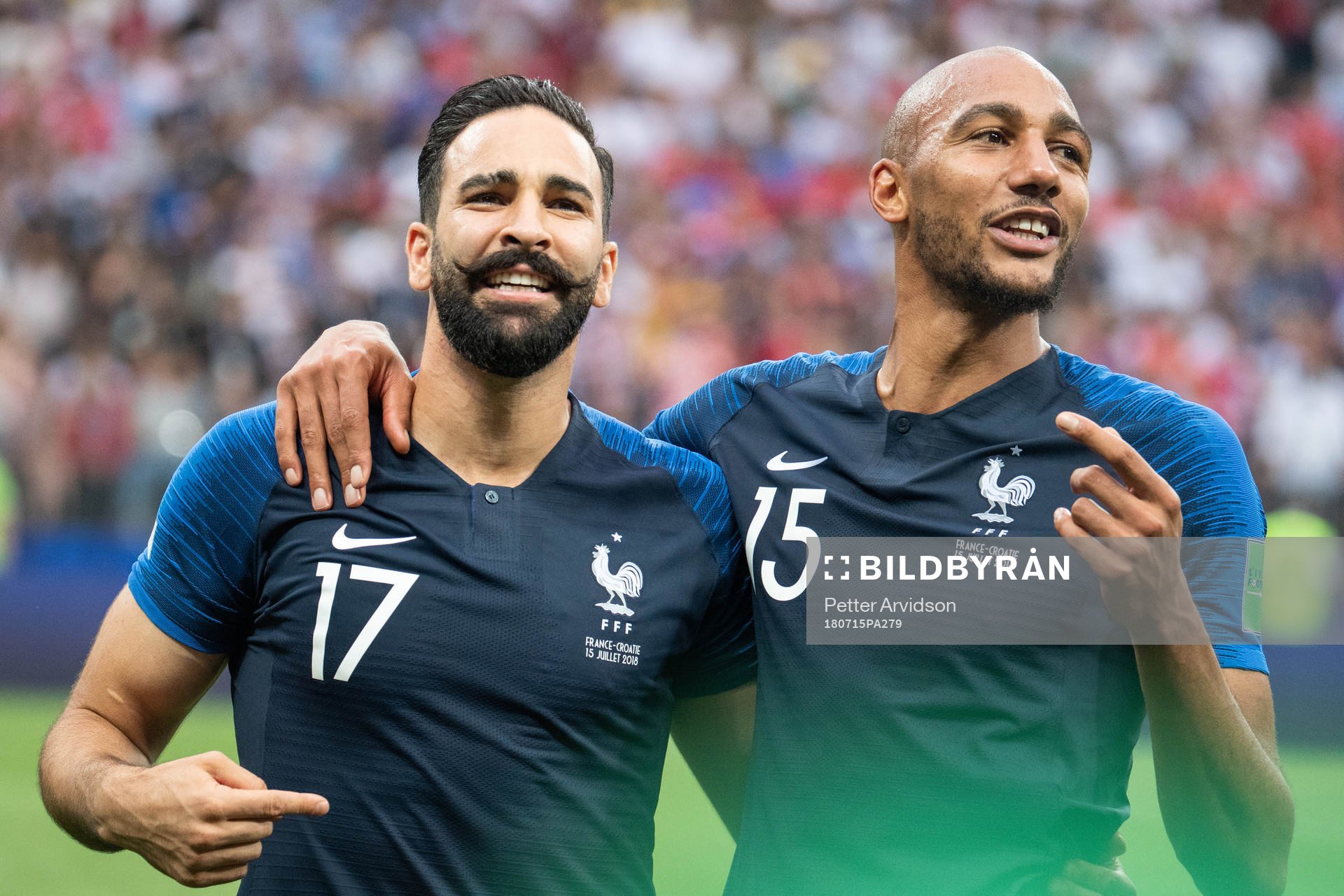 Adil Rami and Steven Nzonzi of France celebrate