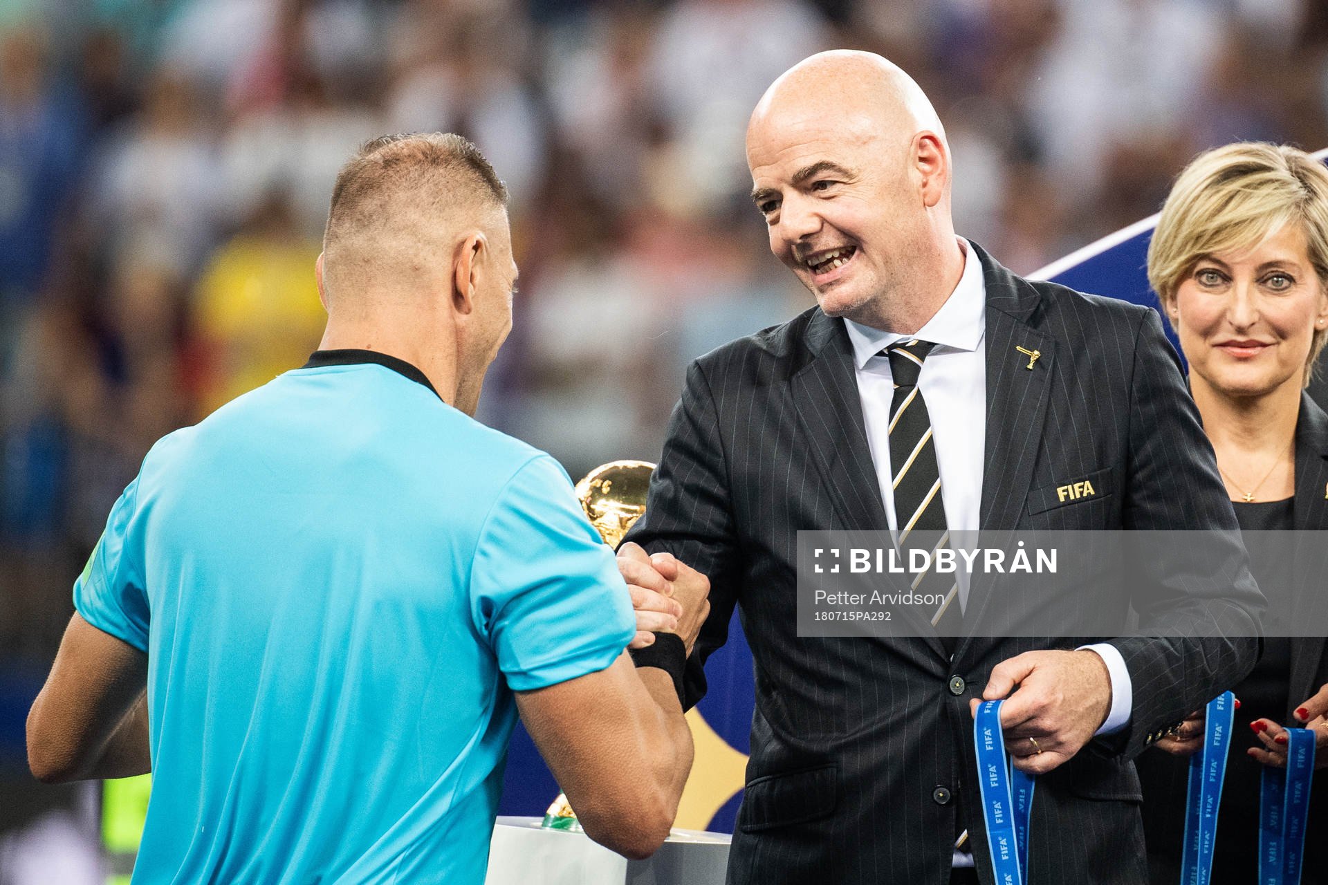 FIFA president Gianni Infantino, hand out a medal to