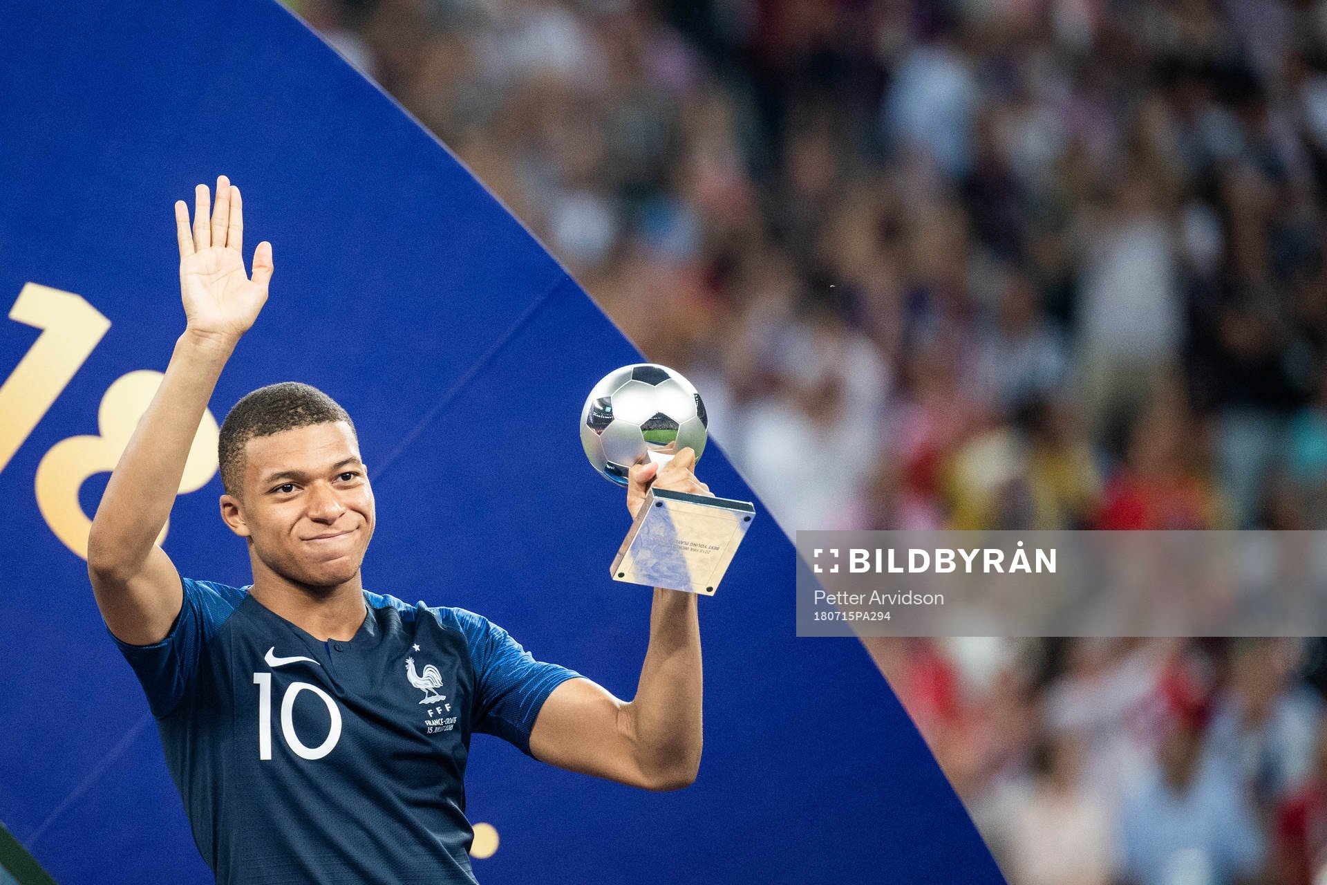 Kylian Mbappe of France with the award for best young