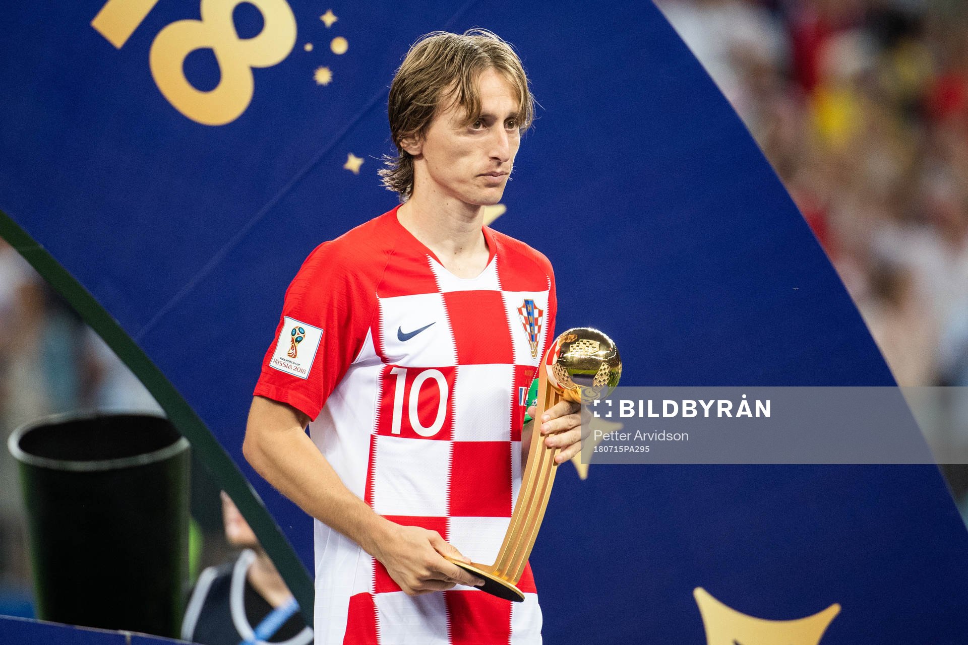 Luka Modric of Croatia with the award to the best player of