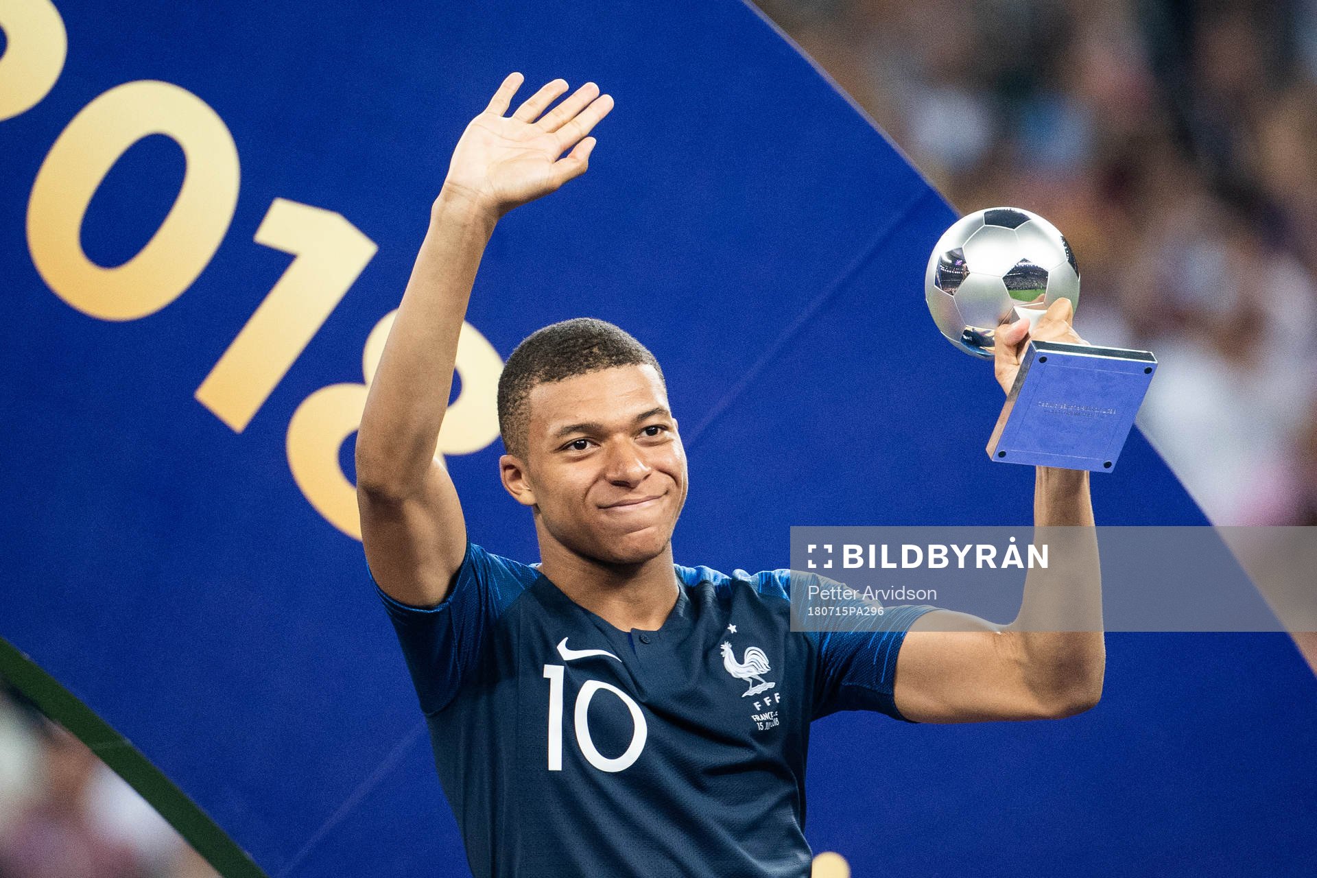 Kylian Mbappe of France with the award for best young