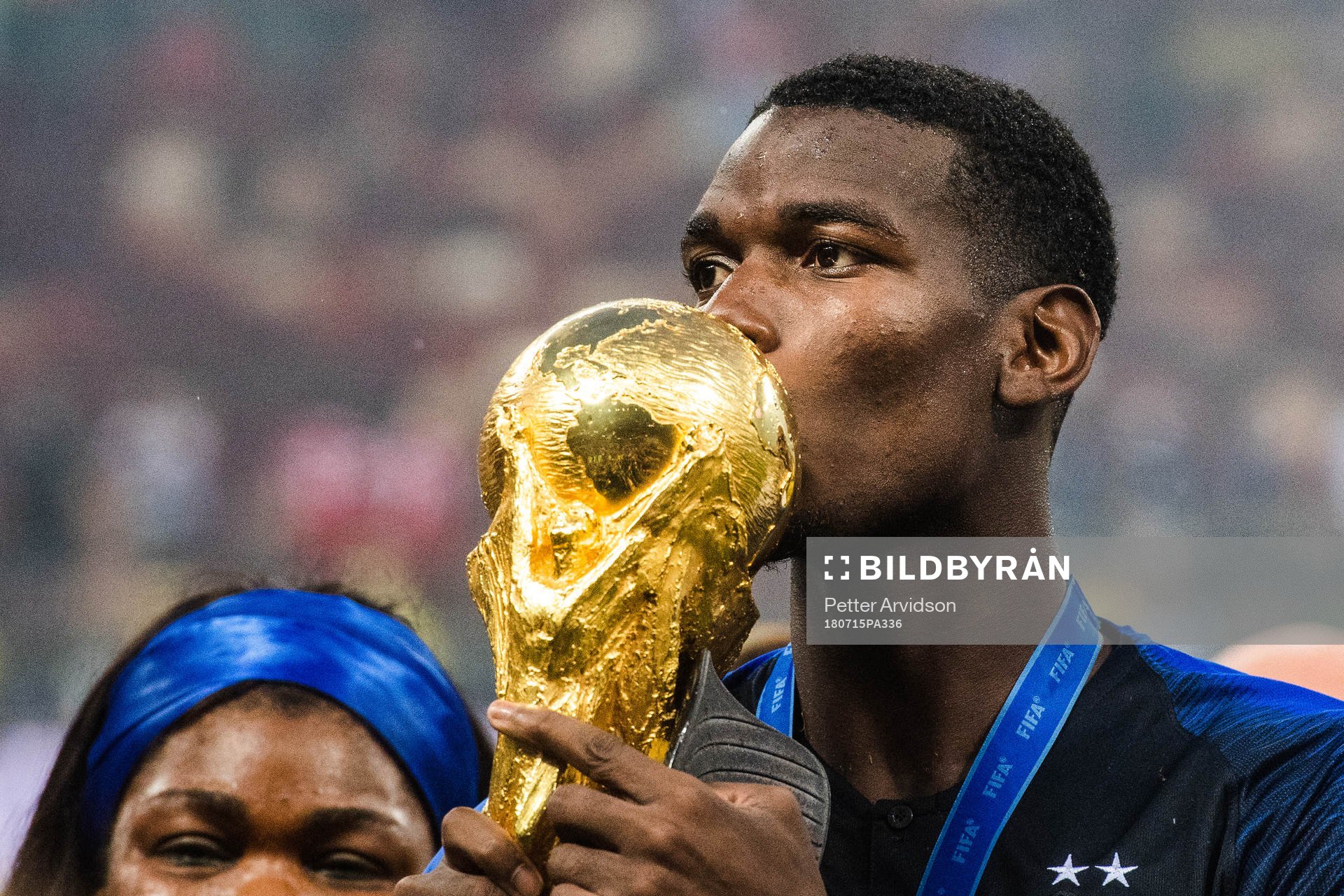 Paul Pogba of France kisses the trophy while celebrating