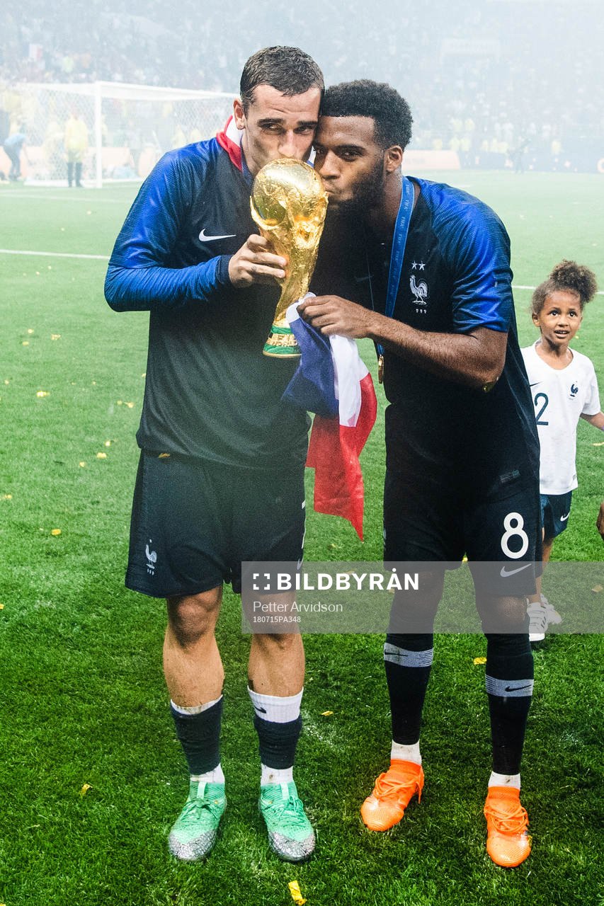 Antoine Griezmann and Thomas Lemar of France celebrate with