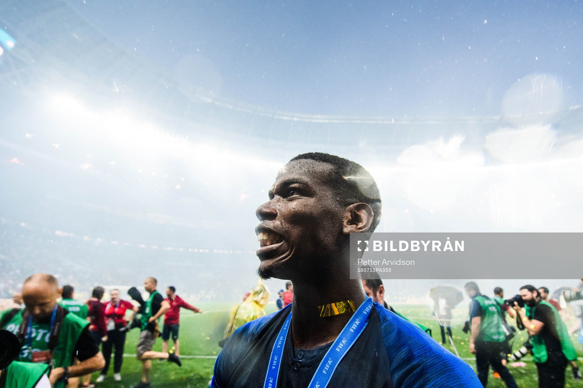 Paul Pogba of France celebrates with the gold medal around