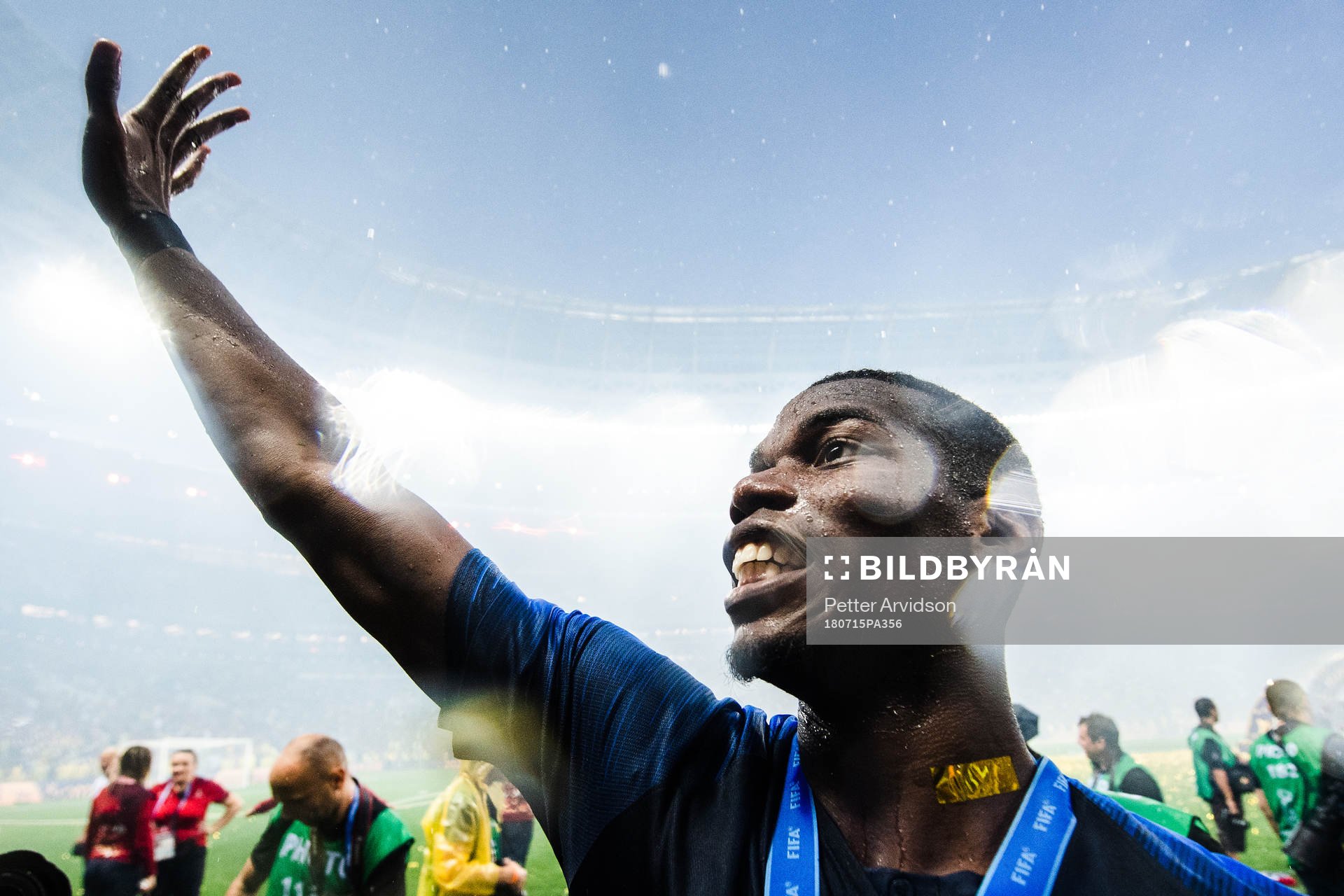 Paul Pogba of France celebrates with the gold medal around