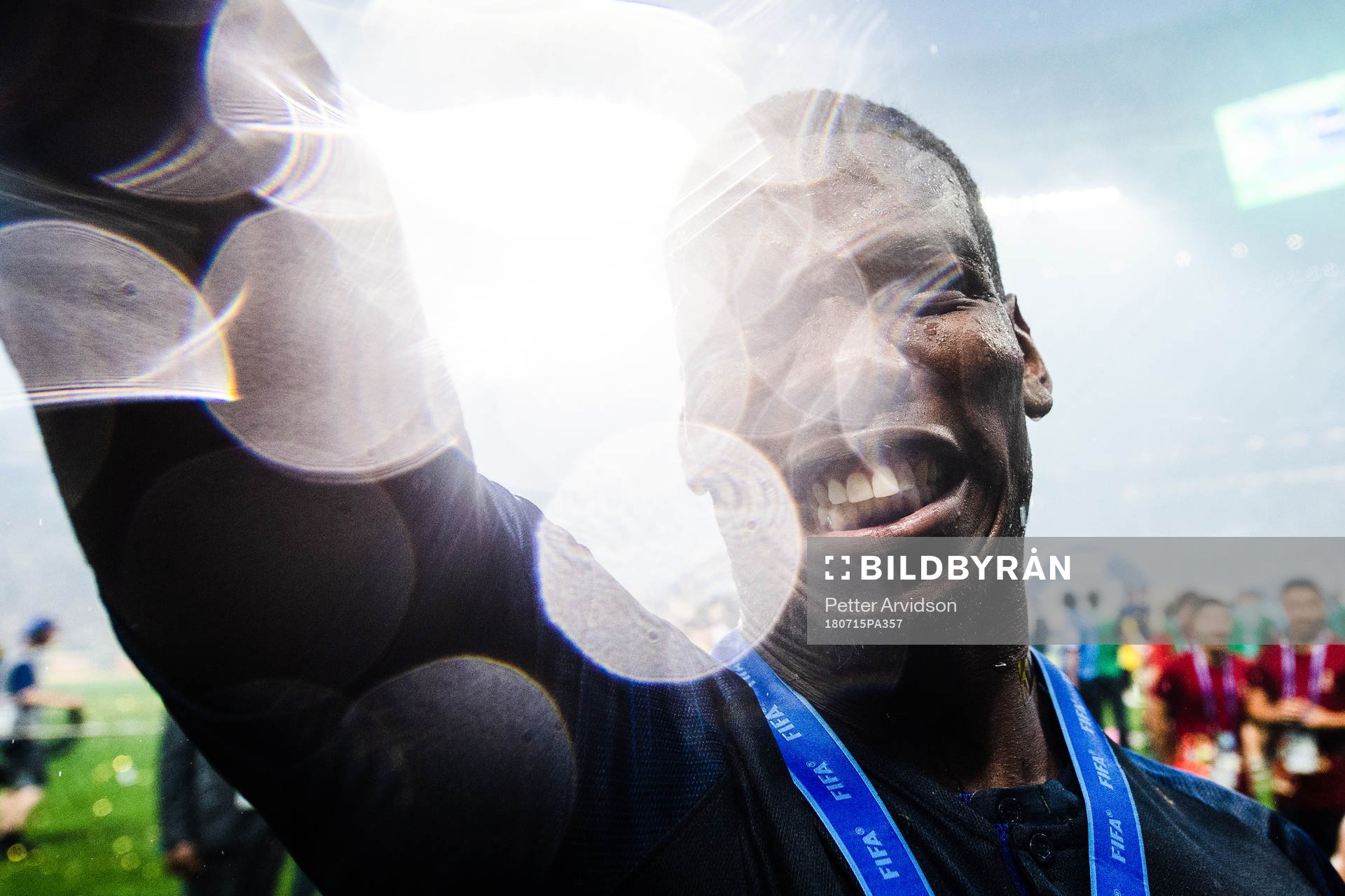 Paul Pogba of France celebrates with the gold medal around