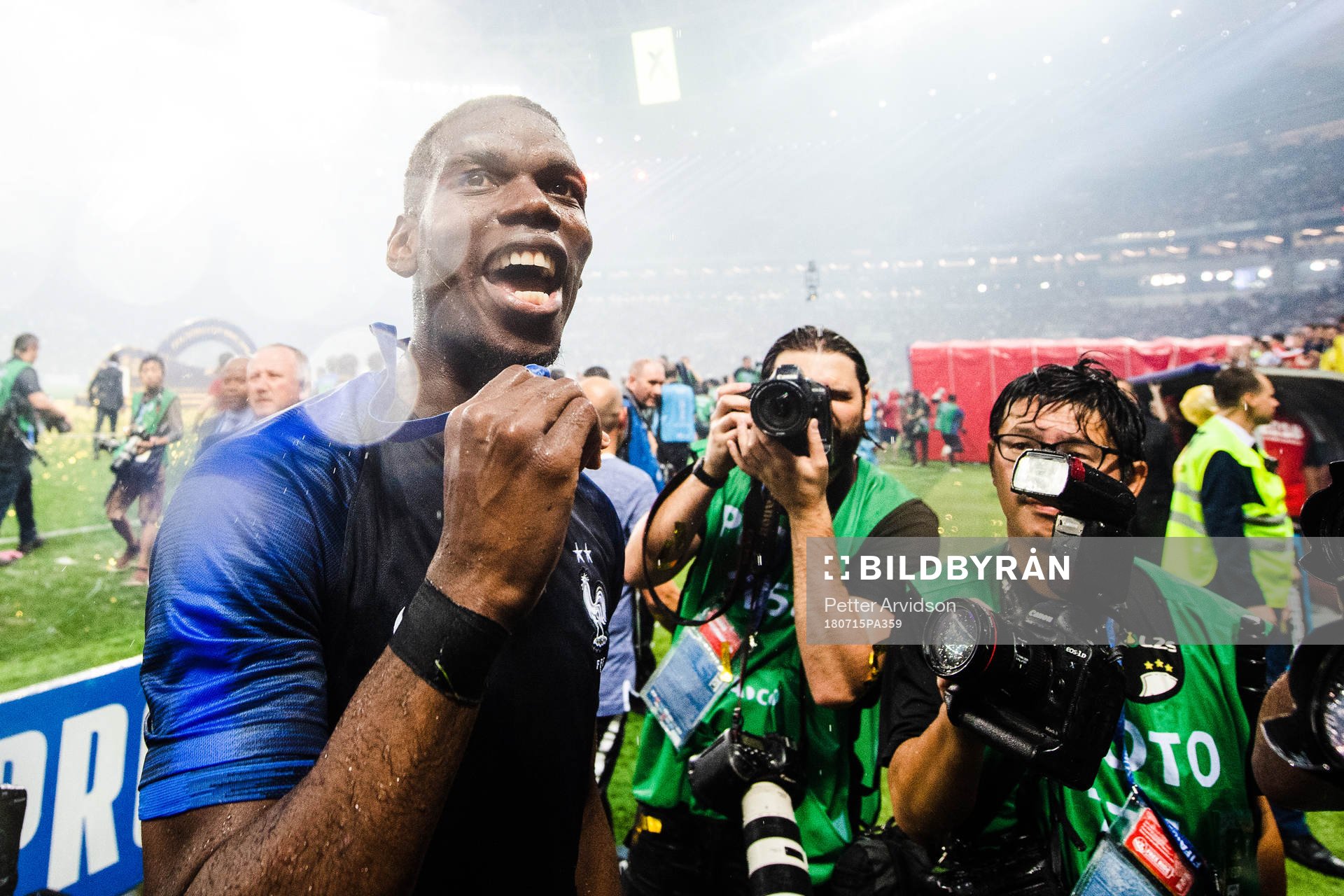 Paul Pogba of France celebrates with the gold medal around