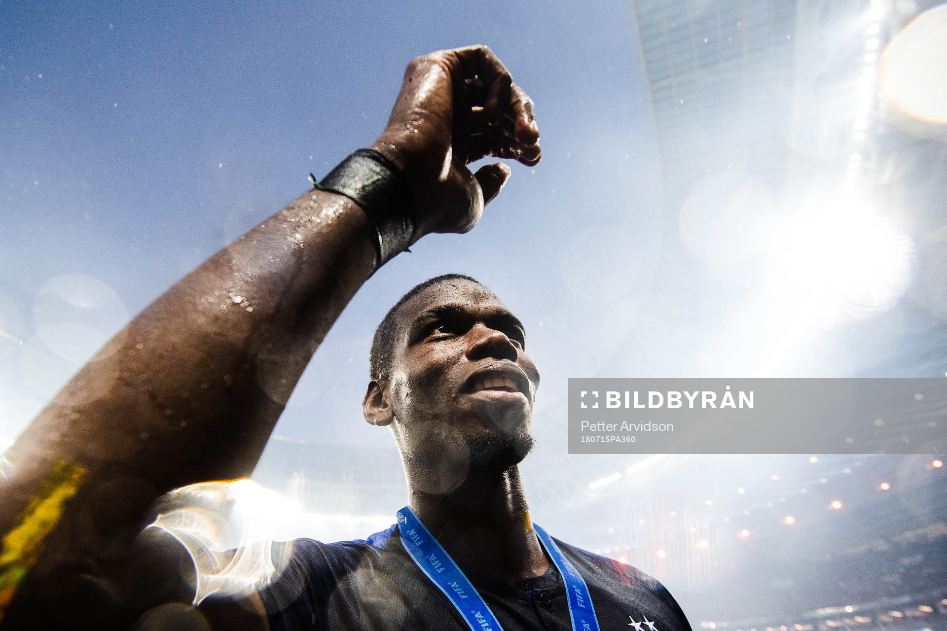 Paul Pogba of France celebrates with the gold medal around