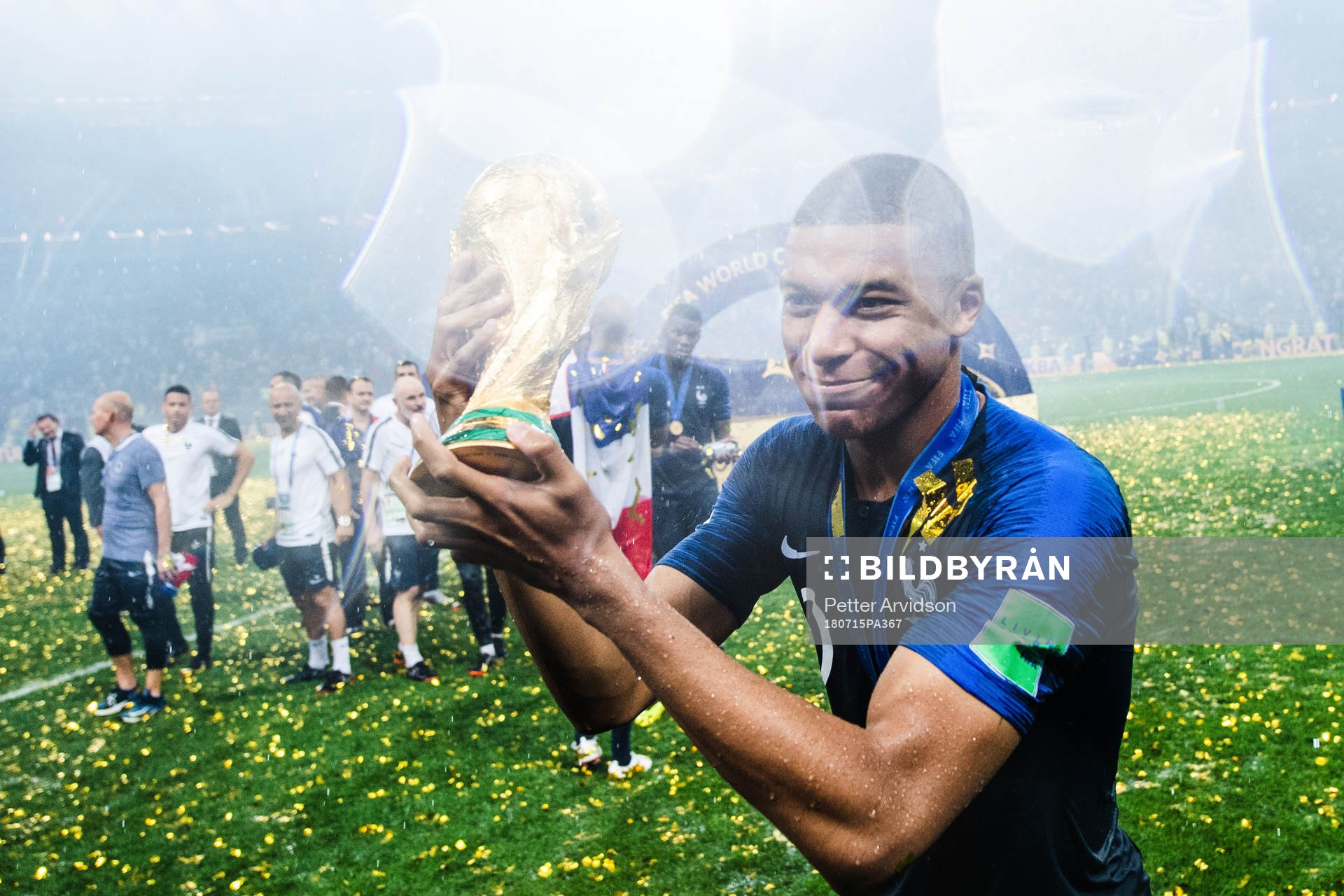 Kylian Mbappe of France celebrates with the trophy