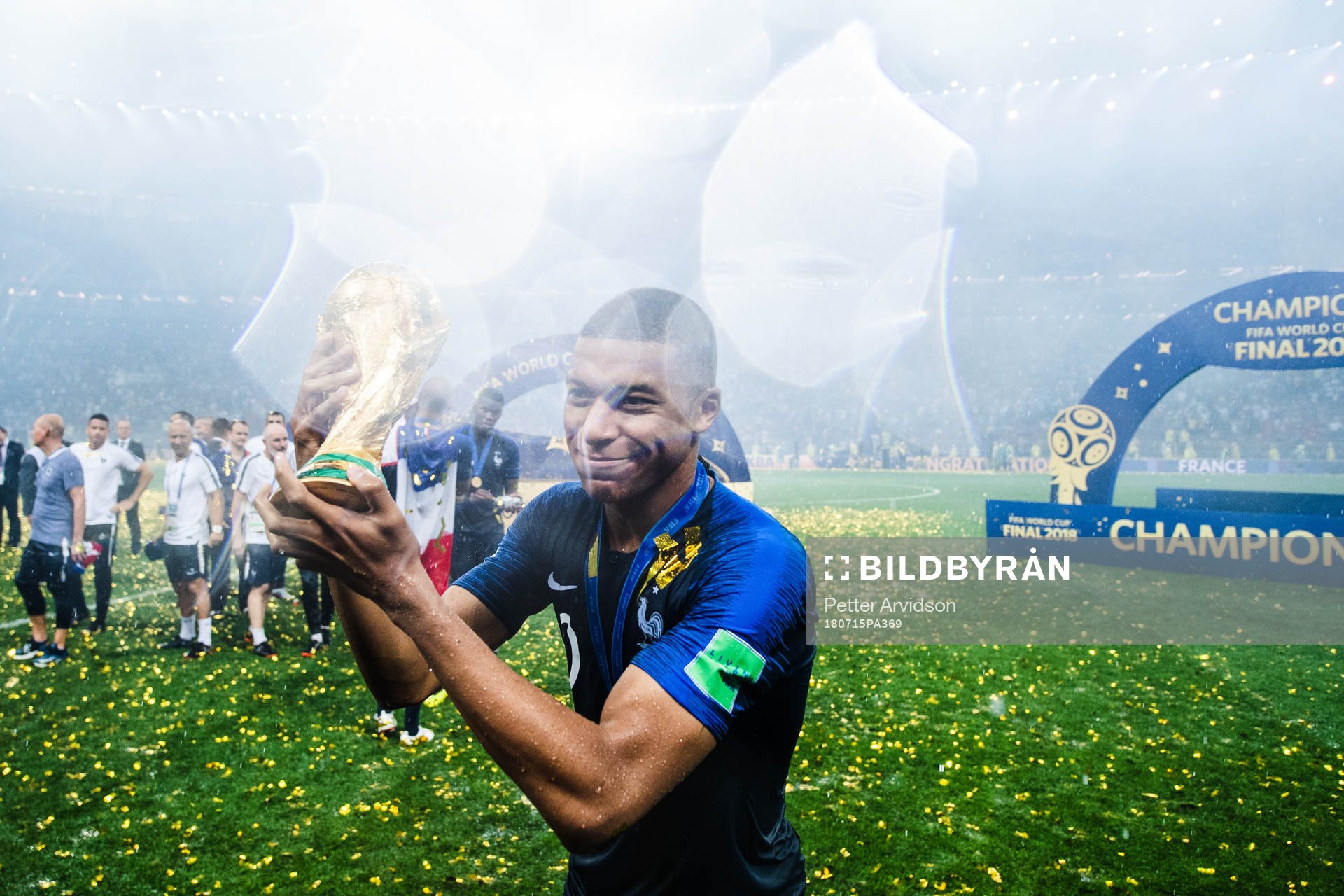Kylian Mbappe of France celebrates with the trophy