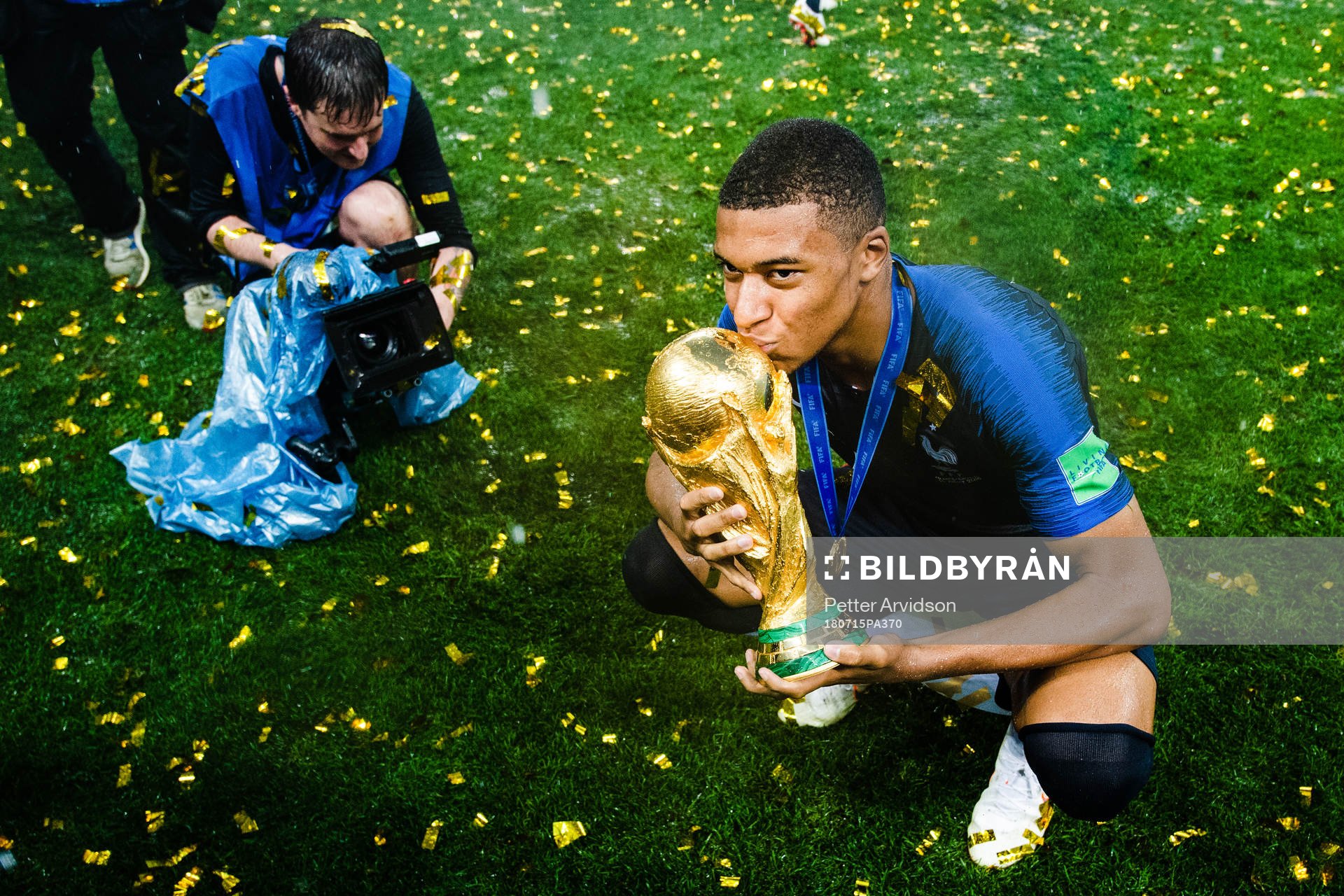 Kylian Mbappe of France celebrates with the trophy