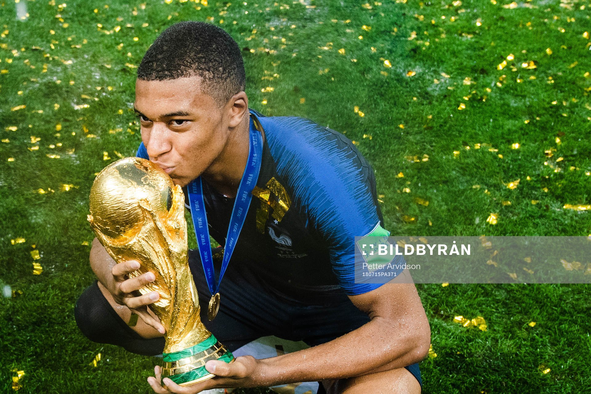 Kylian Mbappe of France celebrates with the trophy