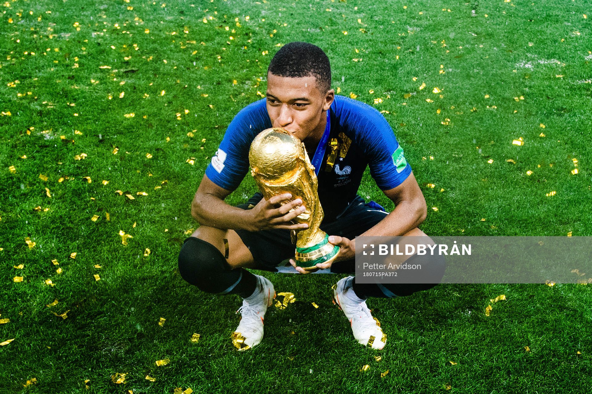 Kylian Mbappe of France celebrates with the trophy