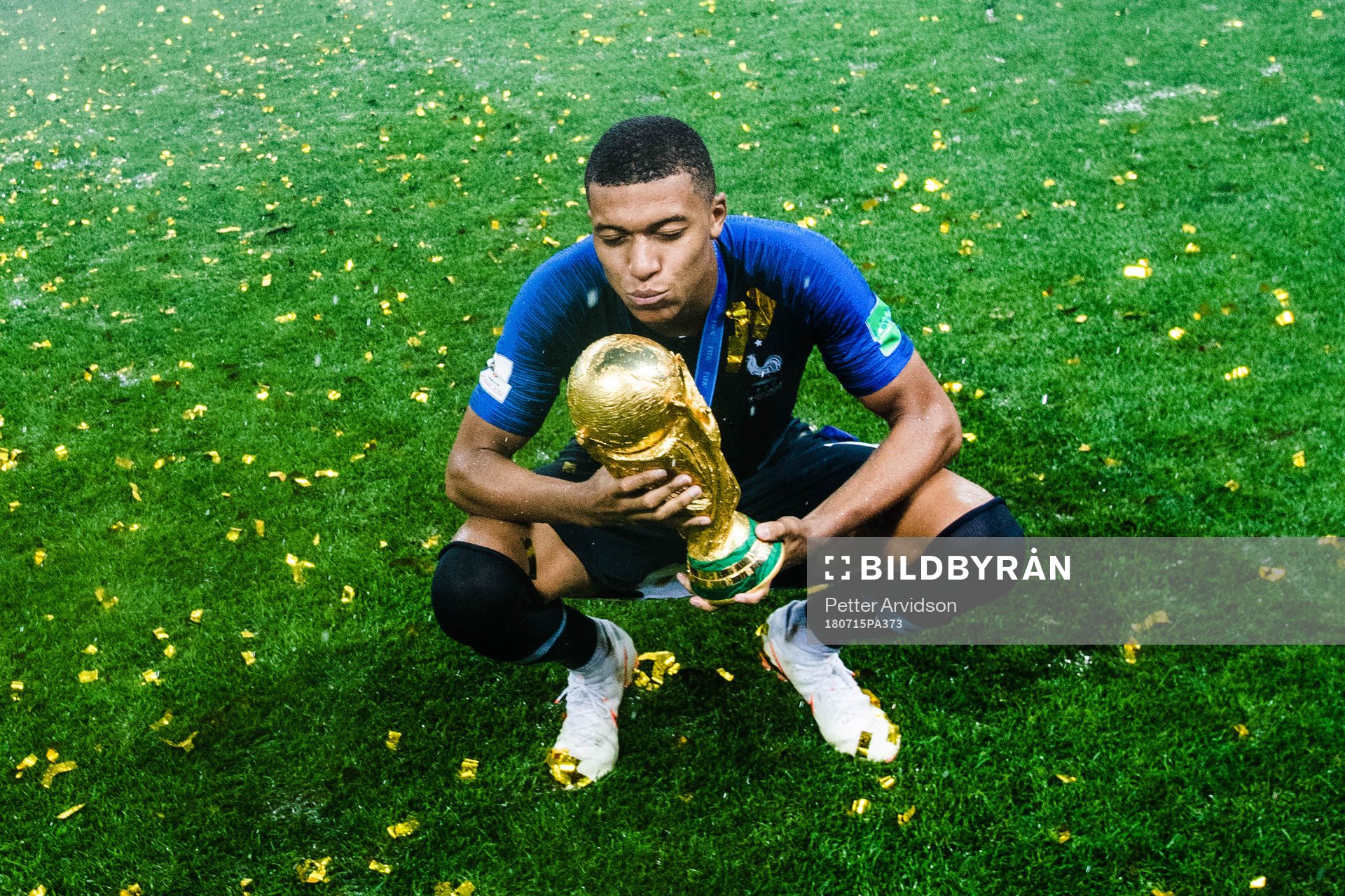Kylian Mbappe of France celebrates with the trophy