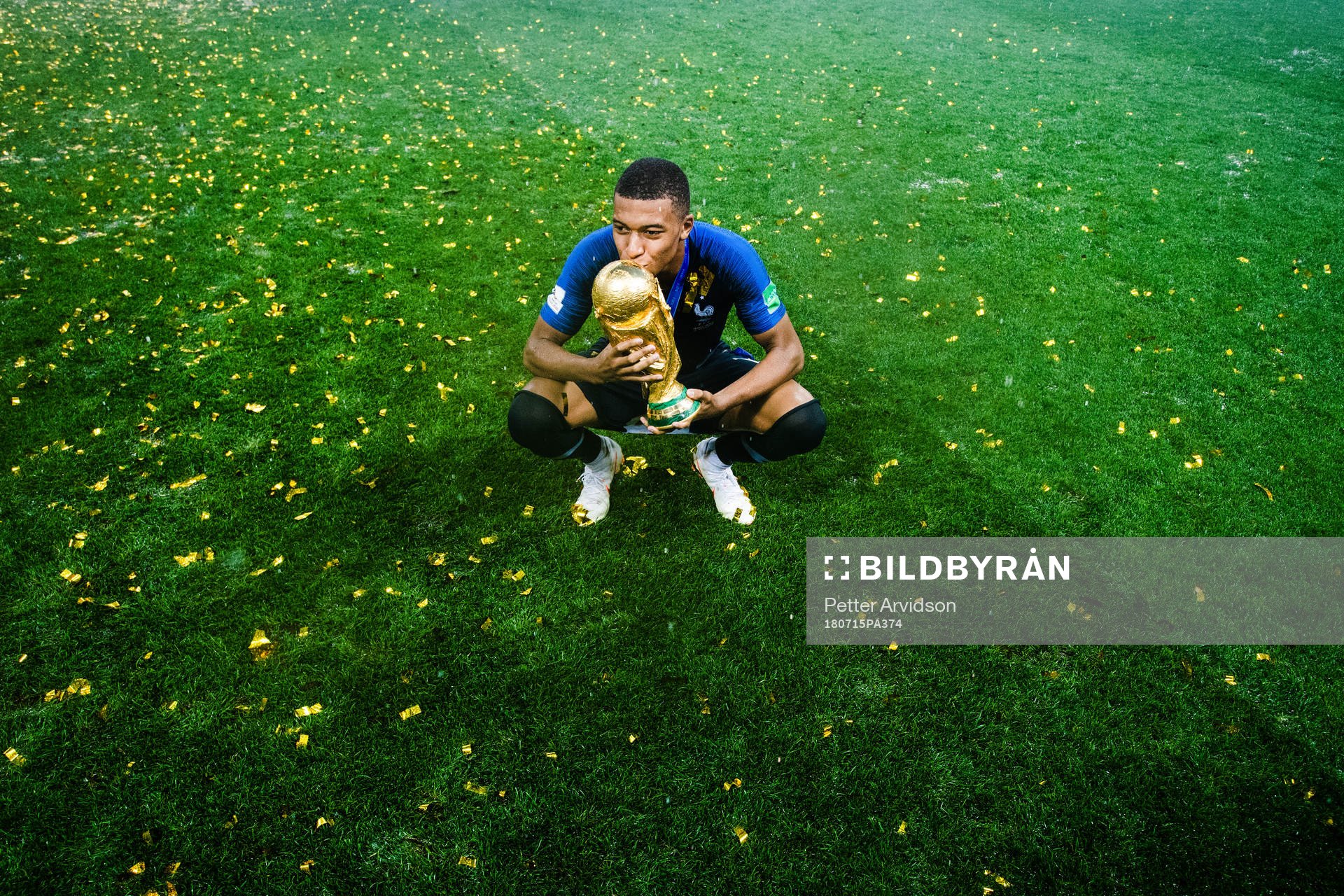 Kylian Mbappe of France celebrates with the trophy