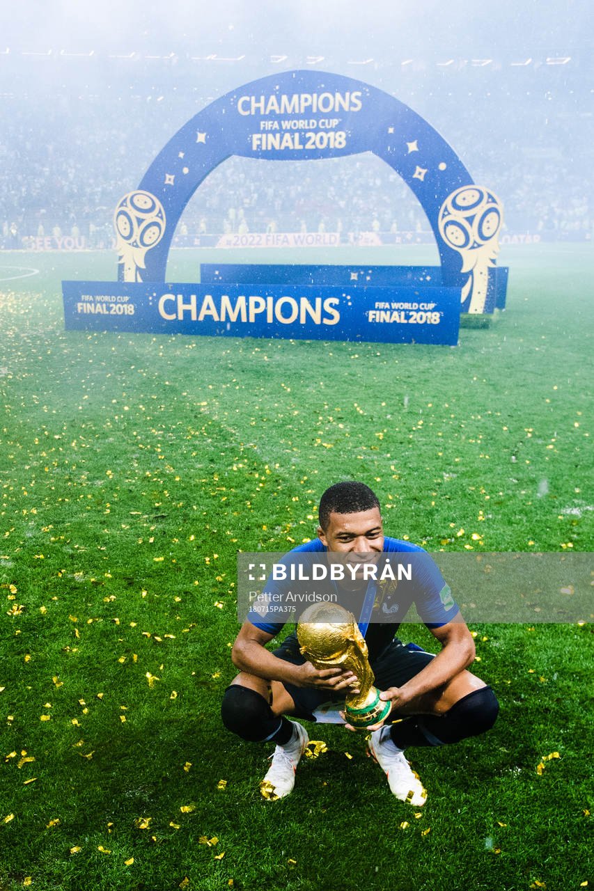 Kylian Mbappe of France celebrates with the trophy