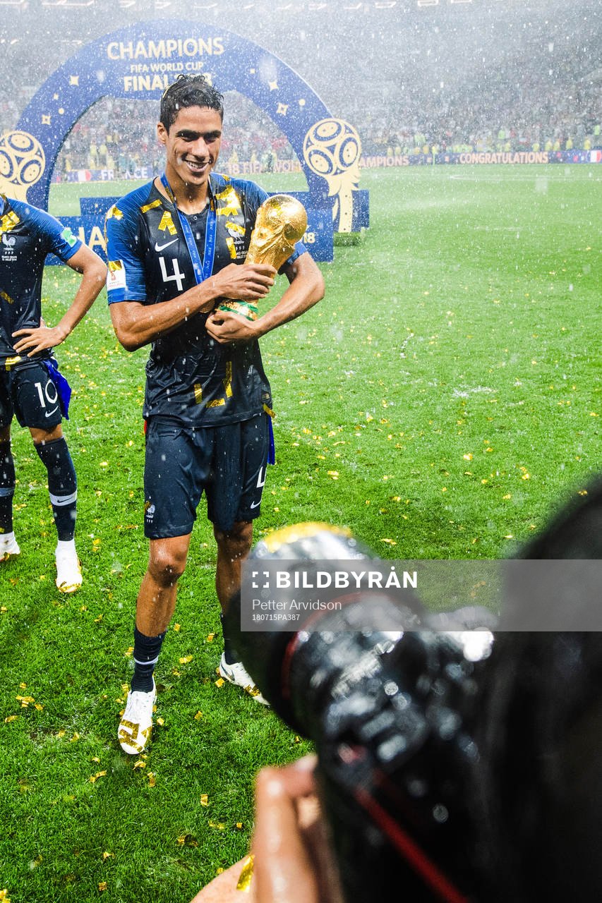 Raphael Varane of France celebrates with the trophy