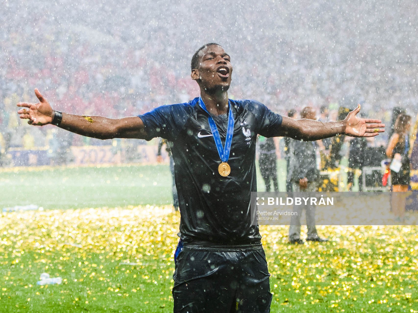 Paul Pogba of France celebrates with the gold medal around
