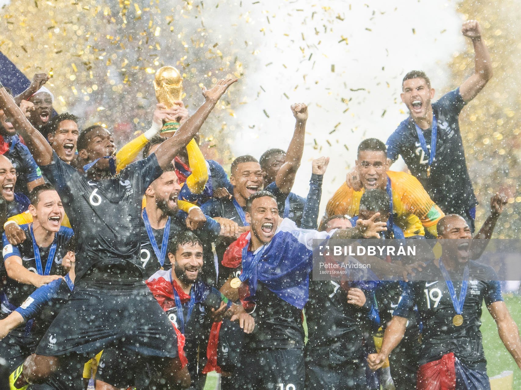 Players of France celebrate with the trophy