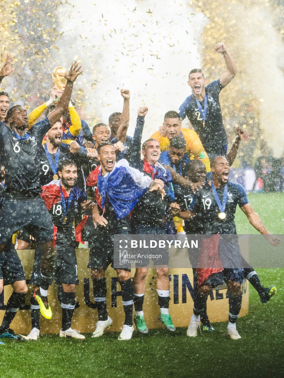 Players of France celebrate with the trophy