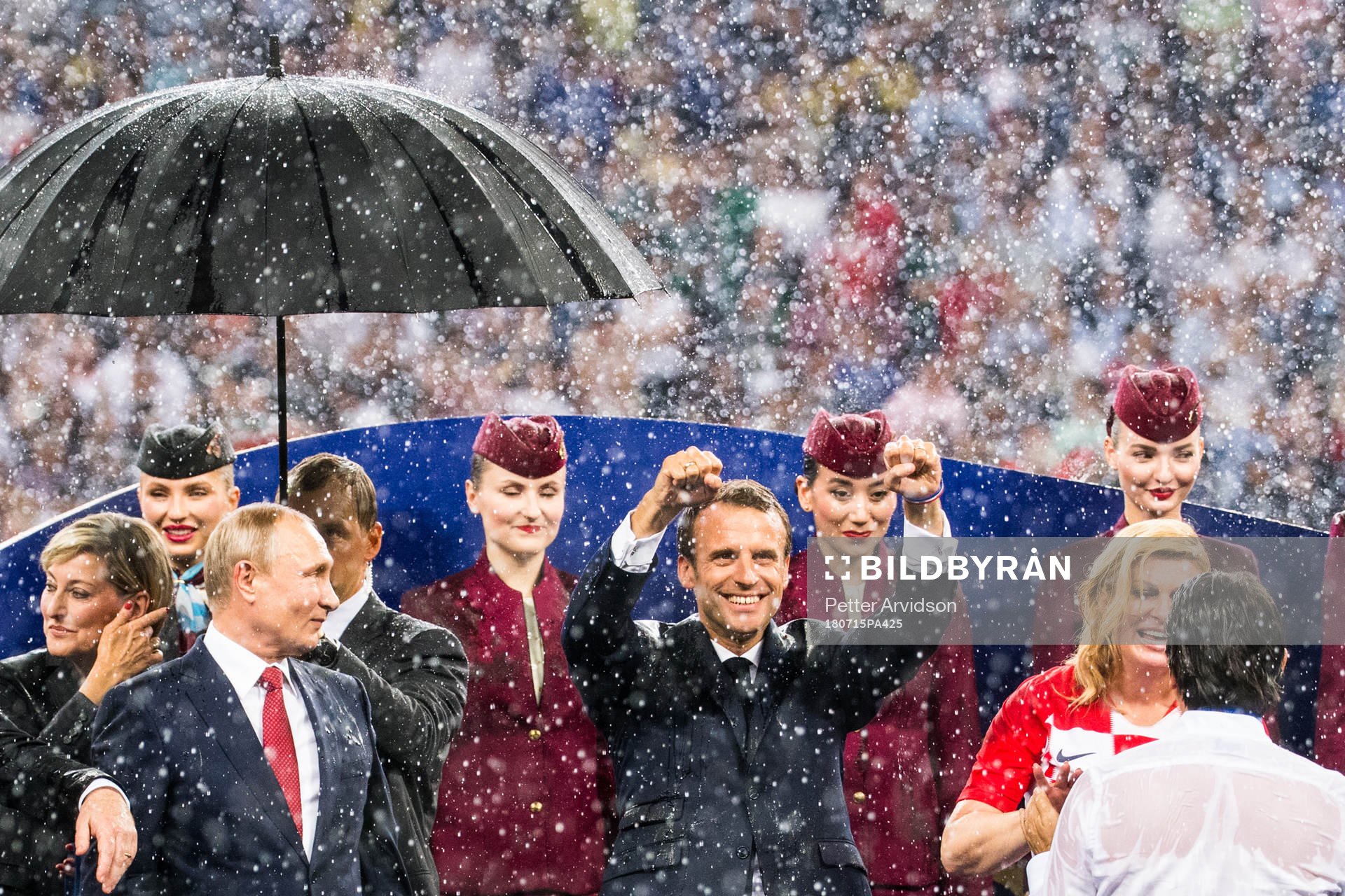 The President of Russia Vladimir Putin, President of France Emmanuel Macron and President of Croatia Kolinda Grabar-Kitarovic at the medal ceremony after the FIFA World Cup final match between France and Croatia on July 15, 2018 in Moscow.
