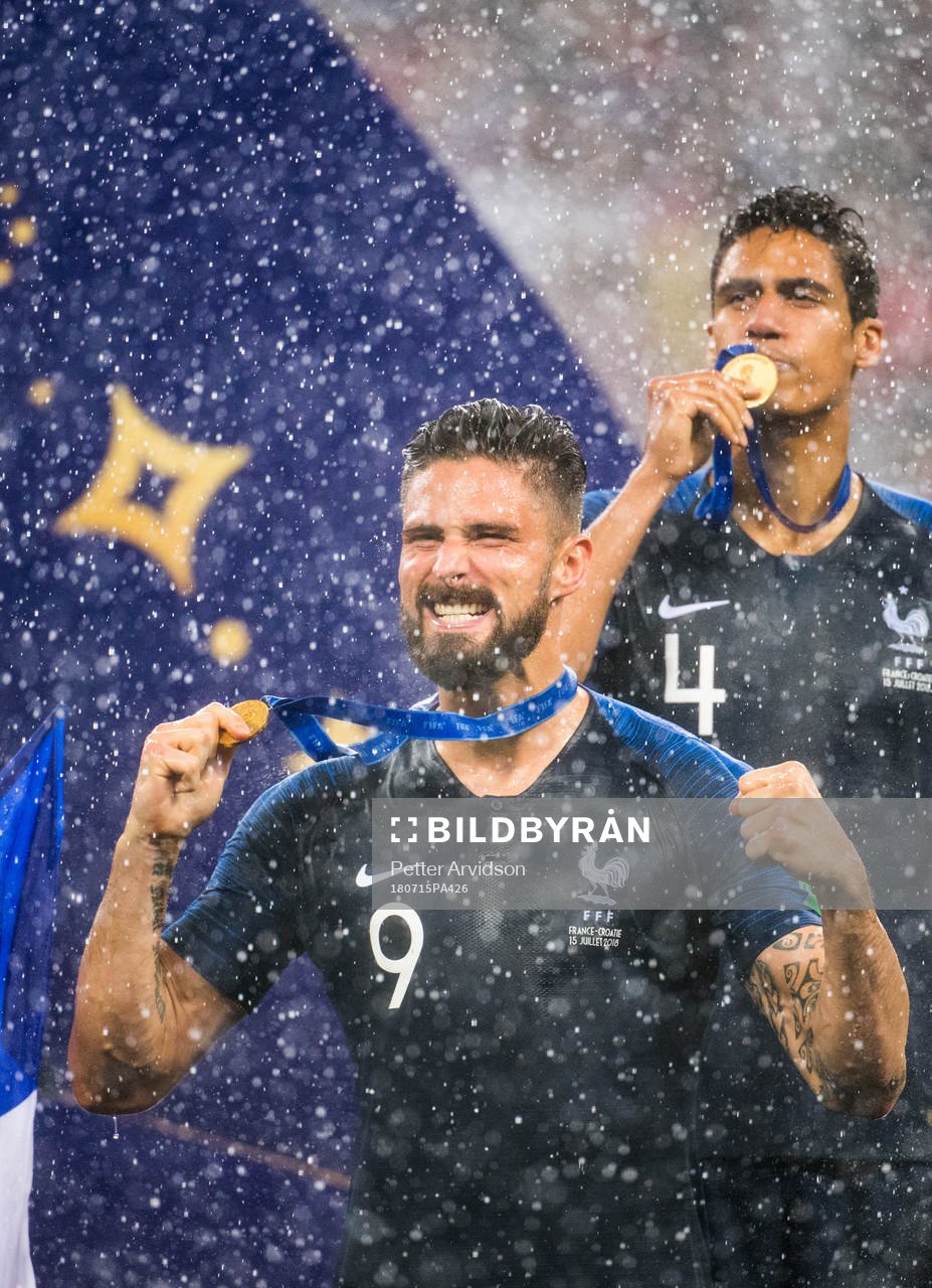 Olivier Giroud and Raphael Varane of France celebrate with