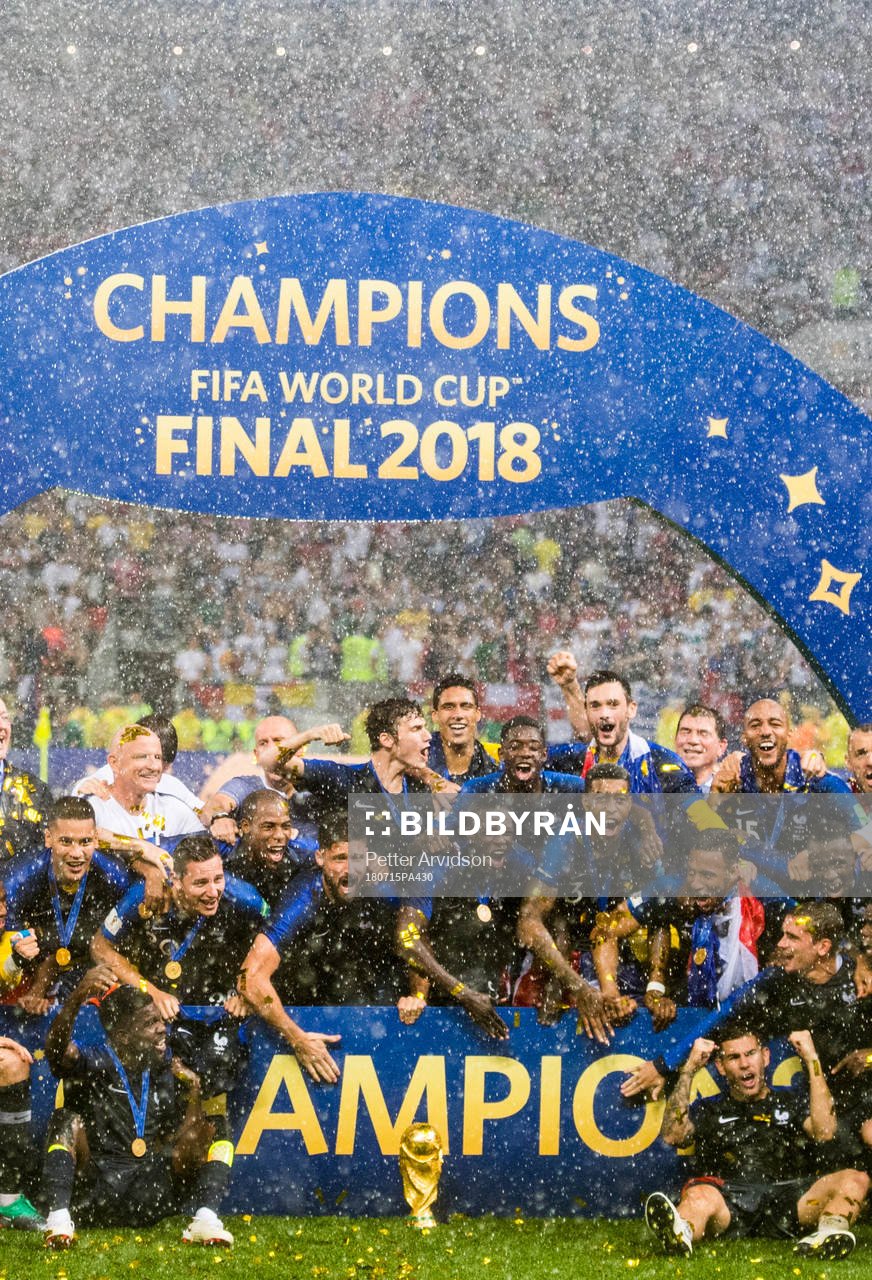 Players of France celebrate with the trophy