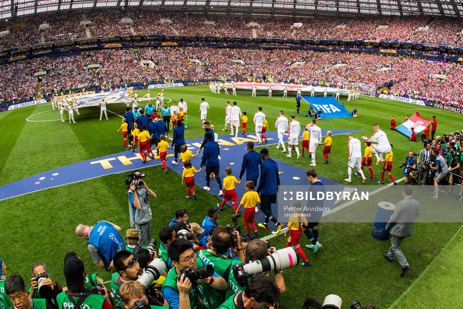 Players of France and of Croatia enter the pitch prior to