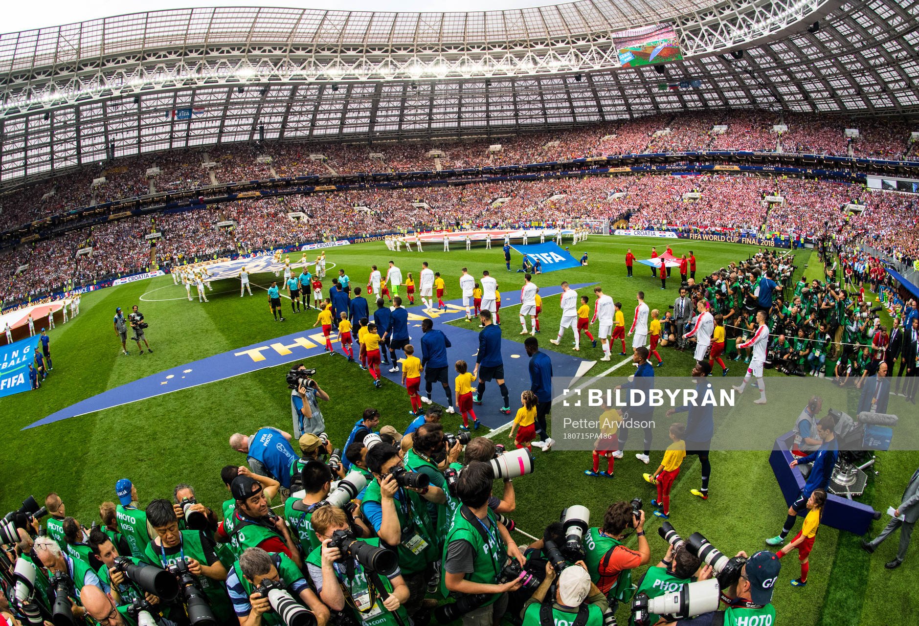 Players of France and of Croatia enter the pitch prior to