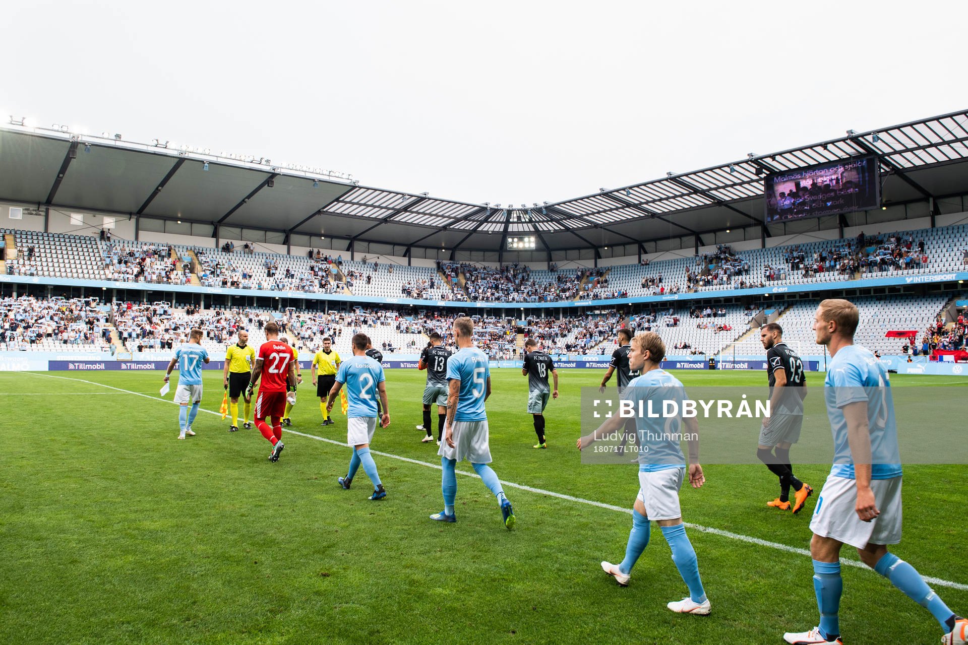 Players of Malmö FF and of Drita enter the pitch