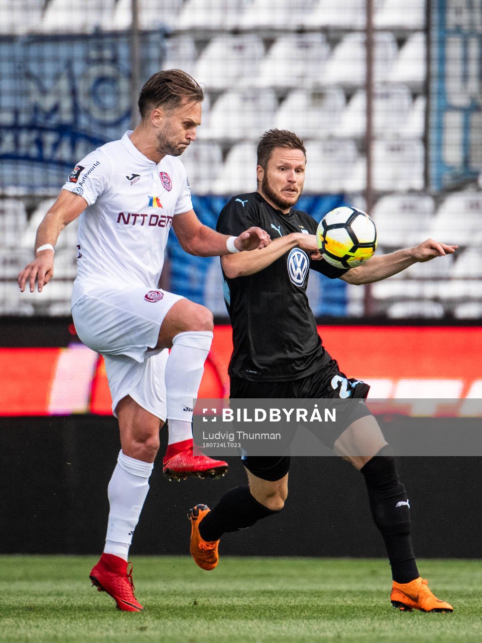 Billel Omrani of Cluj clears the ball in front of Lasse