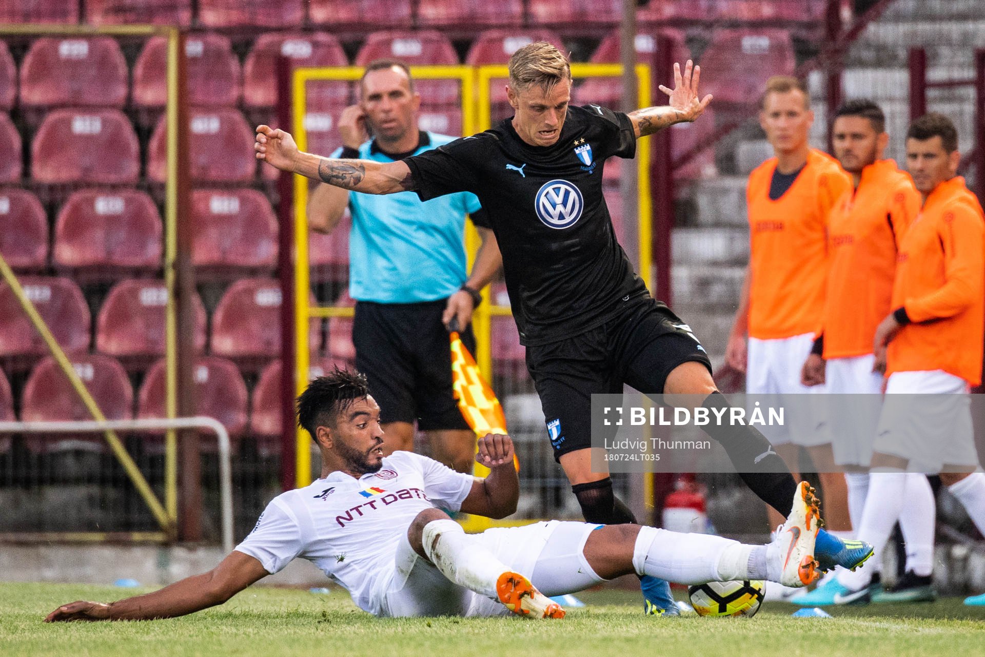 Billel Omrani of Cluj slide tackle against Sören Rieks of